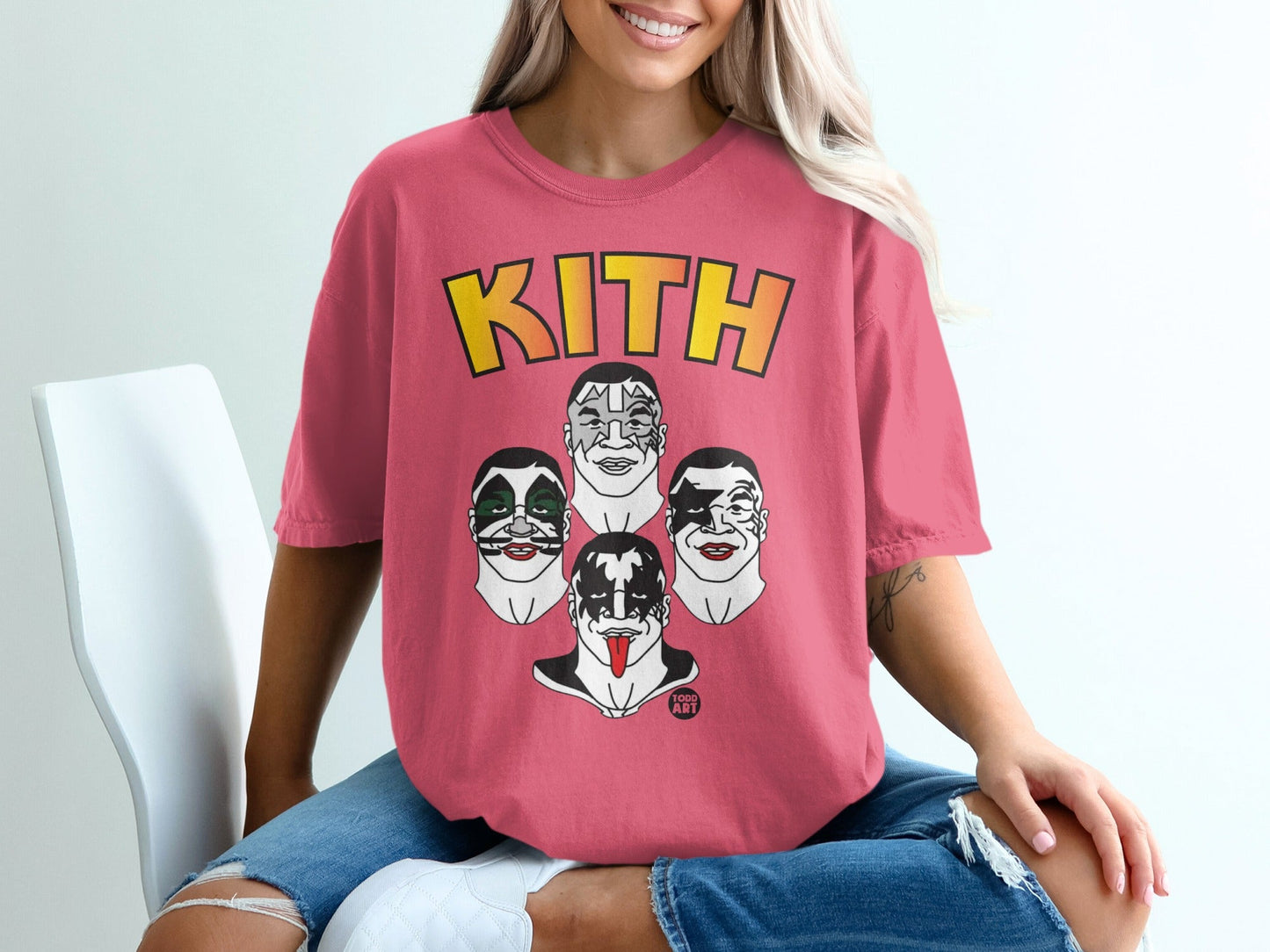 Kith logo above four stylized KISS band members' faces on a pink t-shirt.