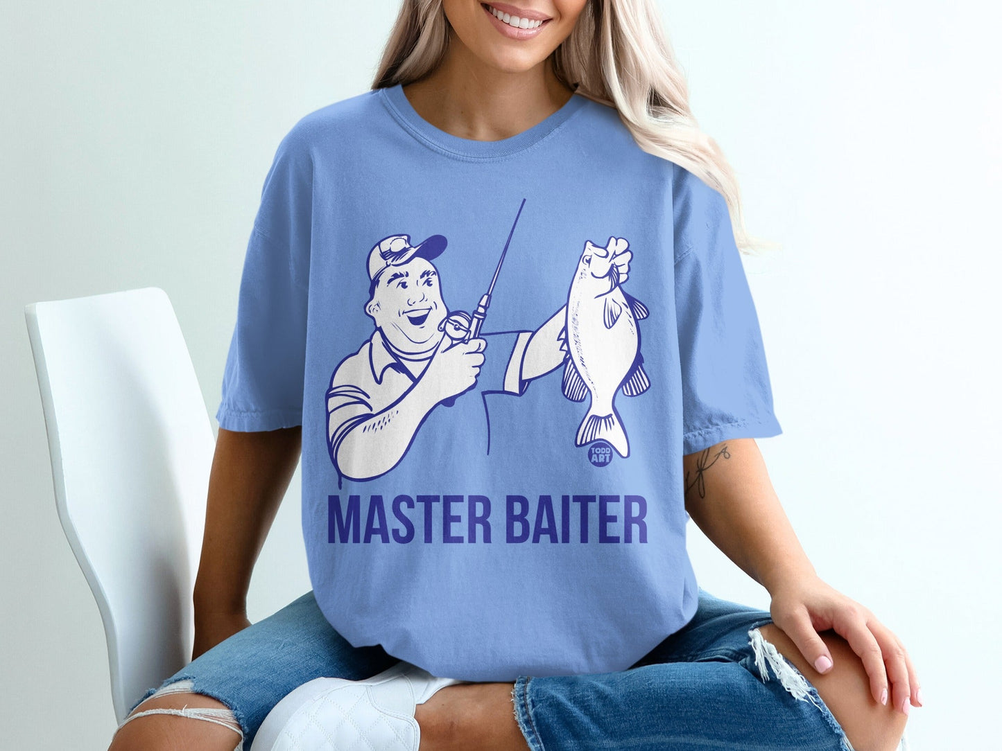 Blue t-shirt with cartoon fisherman holding a fish and "MASTER BAITER" text.