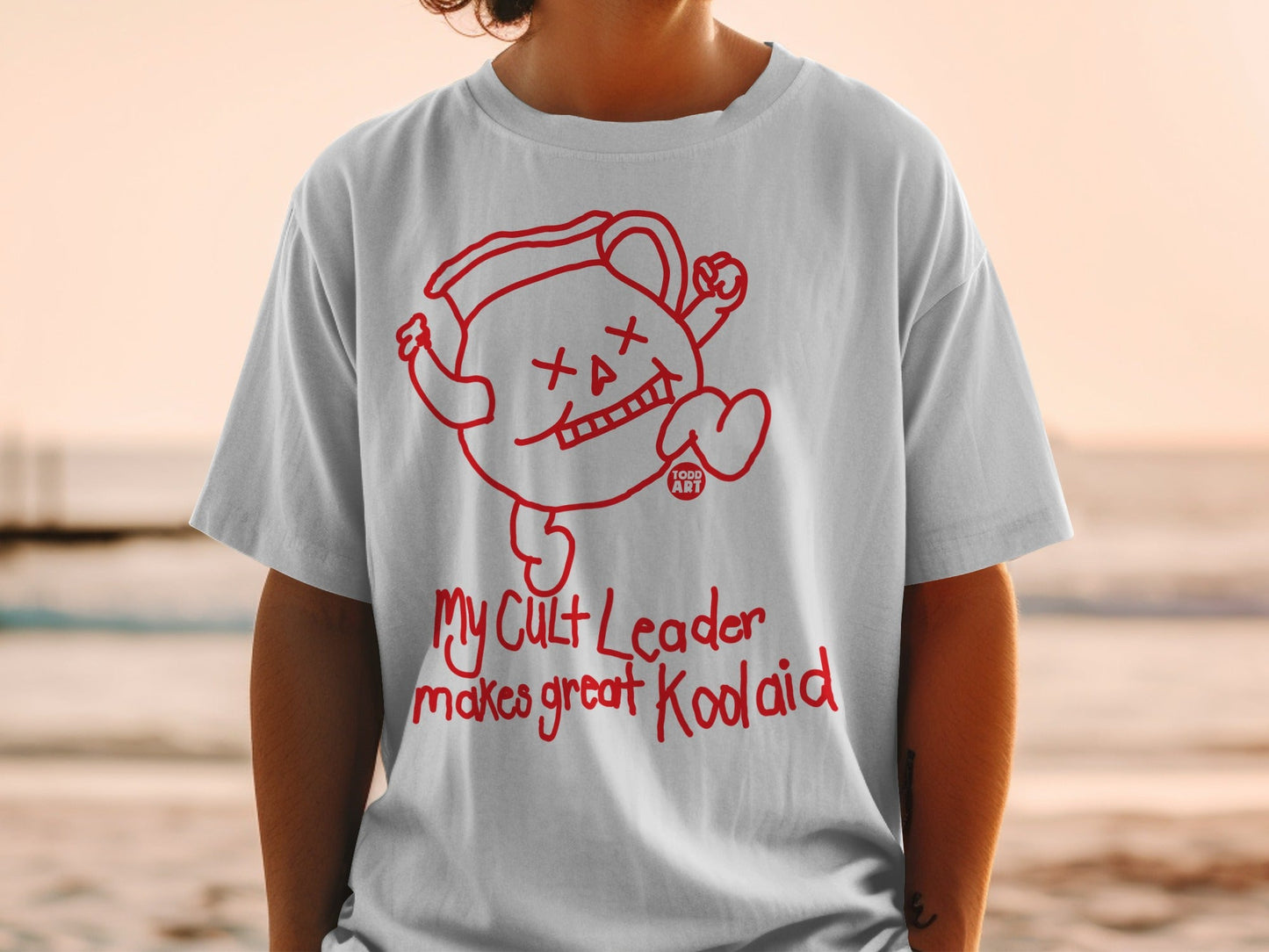 White t-shirt with "My Cult Leader makes great Kool-Aid" graphic.