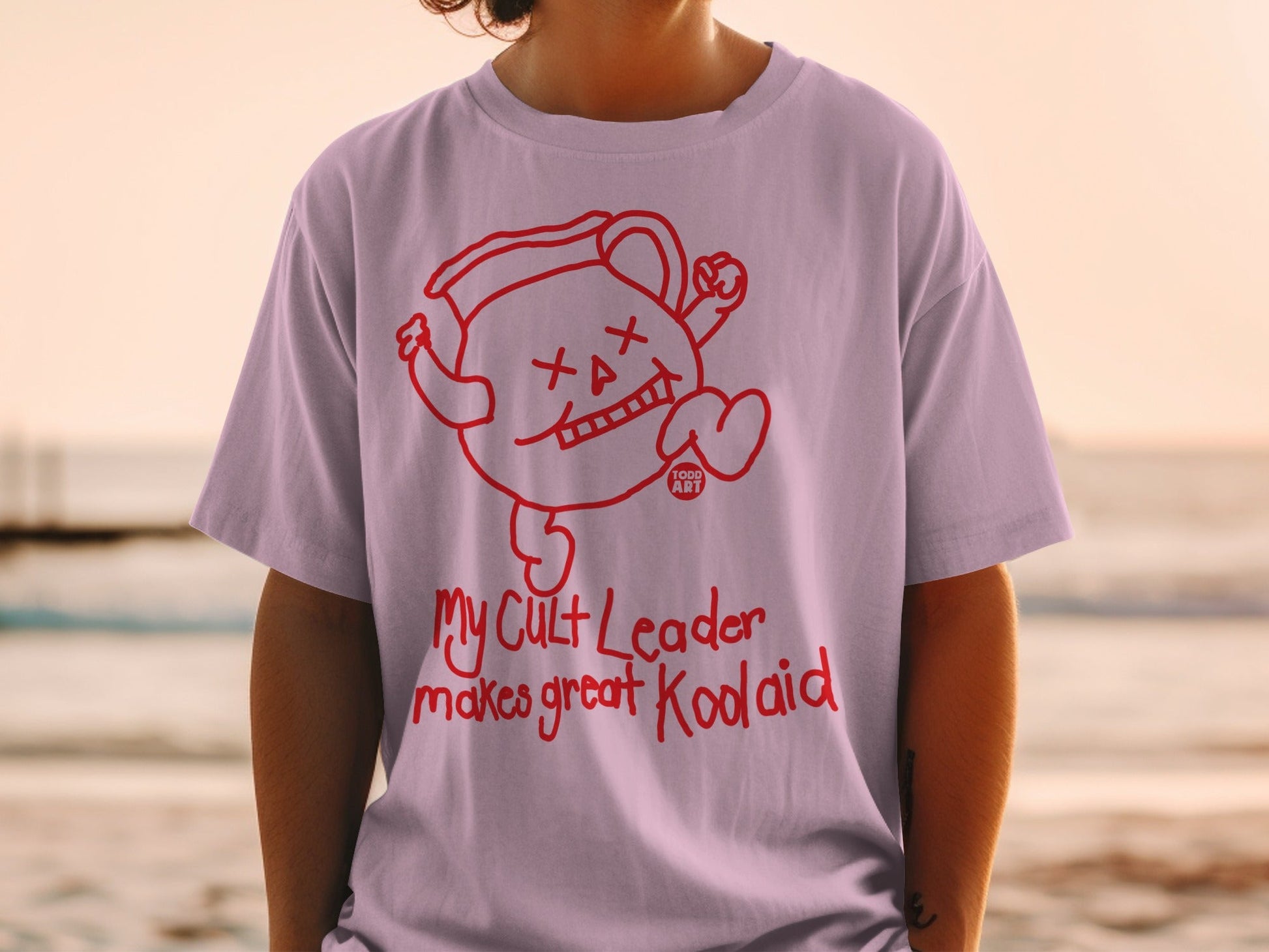 T-shirt with "My Cult Leader makes great Kool-Aid" text and Kool-Aid character graphic.