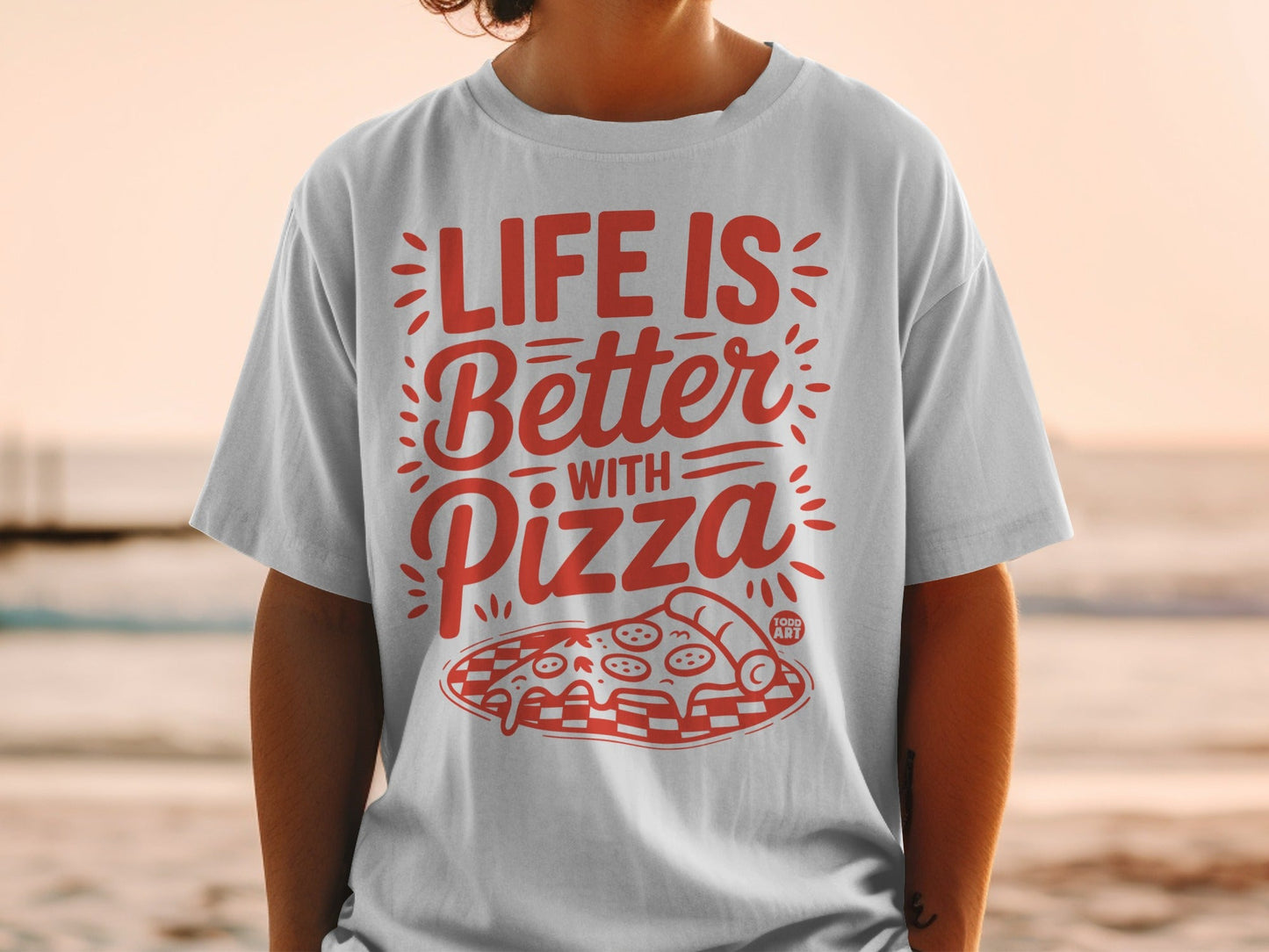 White t-shirt with red text "Life is Better With Pizza" and pizza graphic.