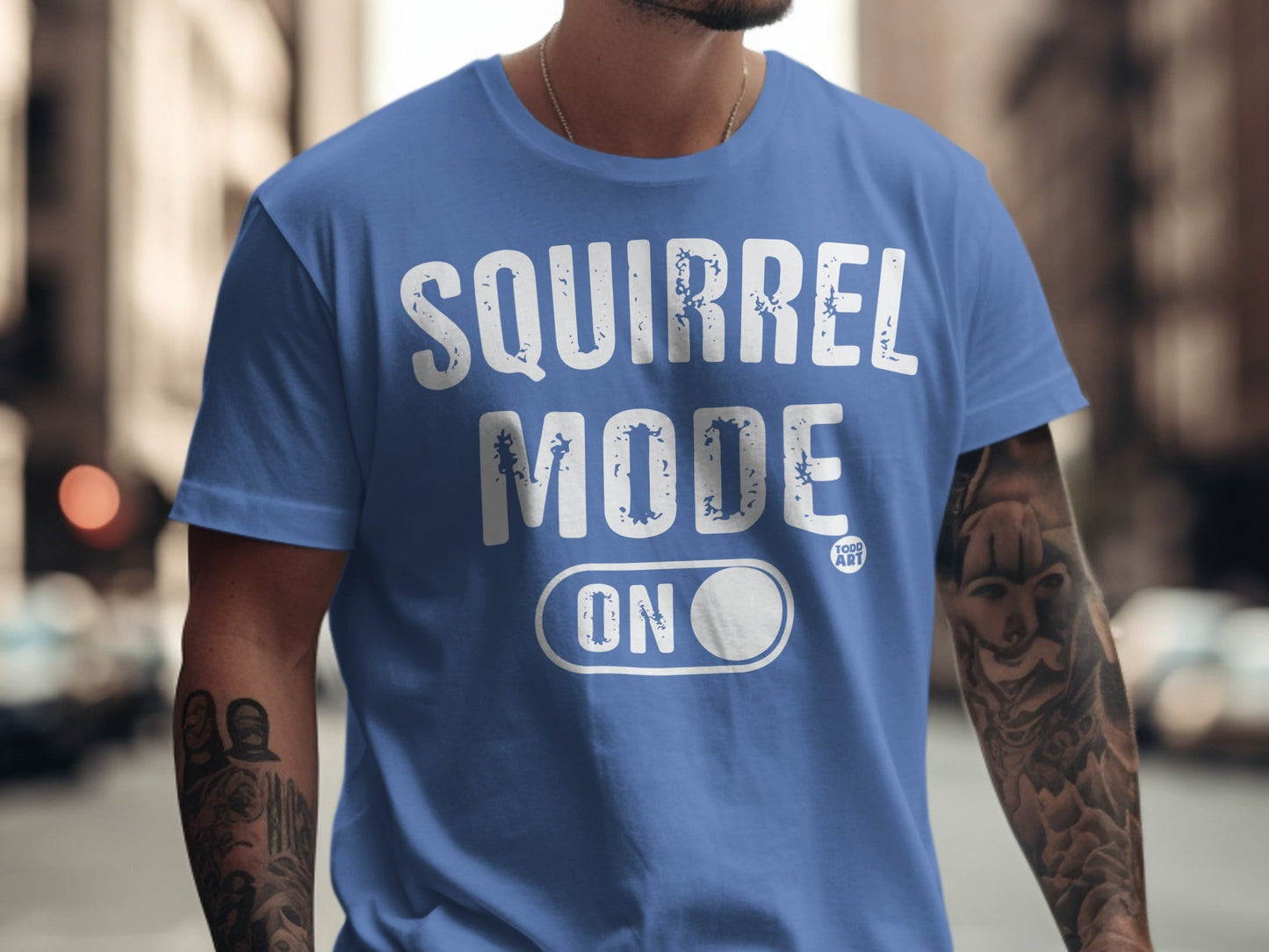 Blue t-shirt with "SQUIRREL MODE ON" text and a squirrel icon.