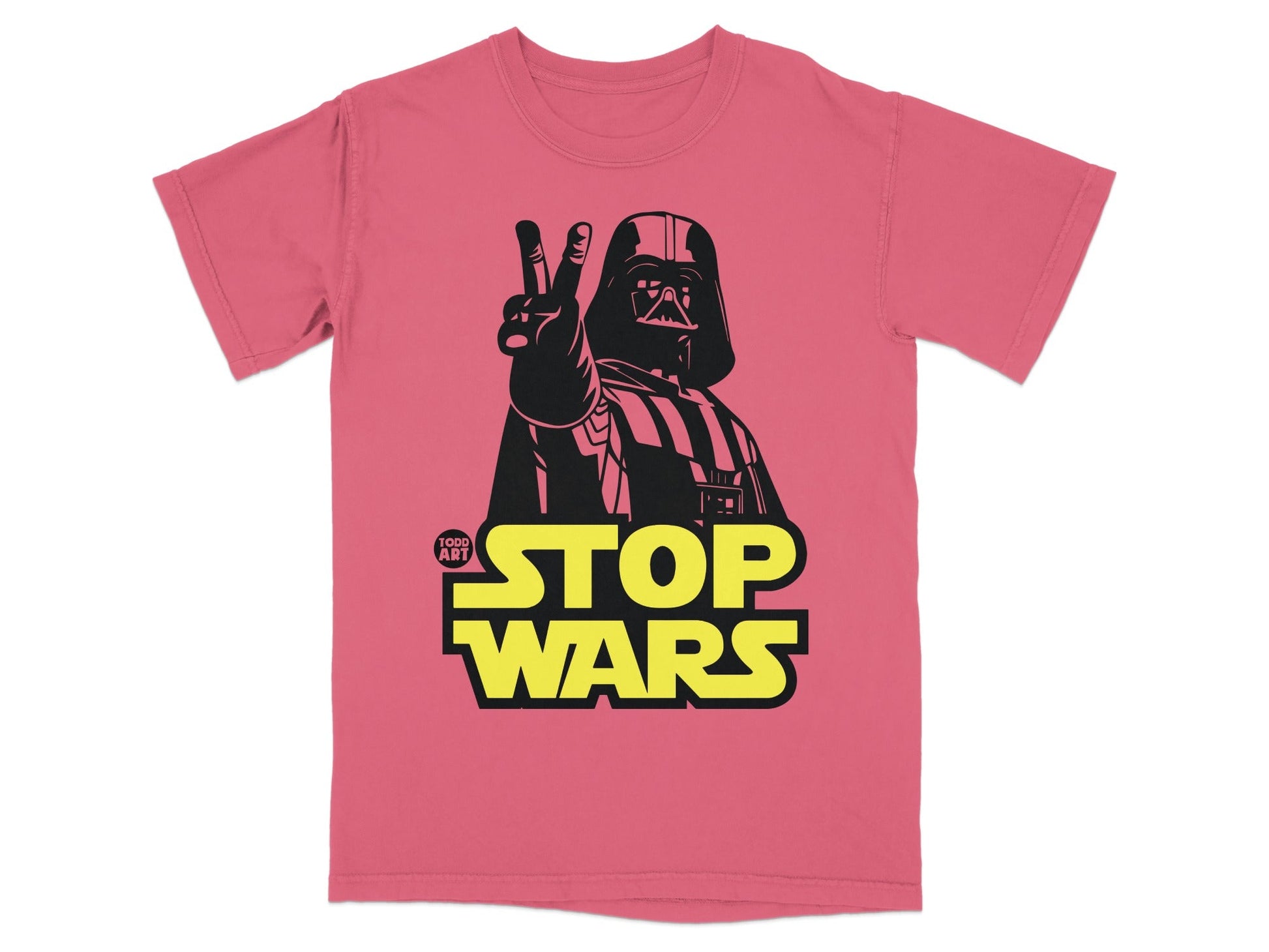 Darth Vader giving a peace sign on a pink t-shirt with "Stop Wars" text.