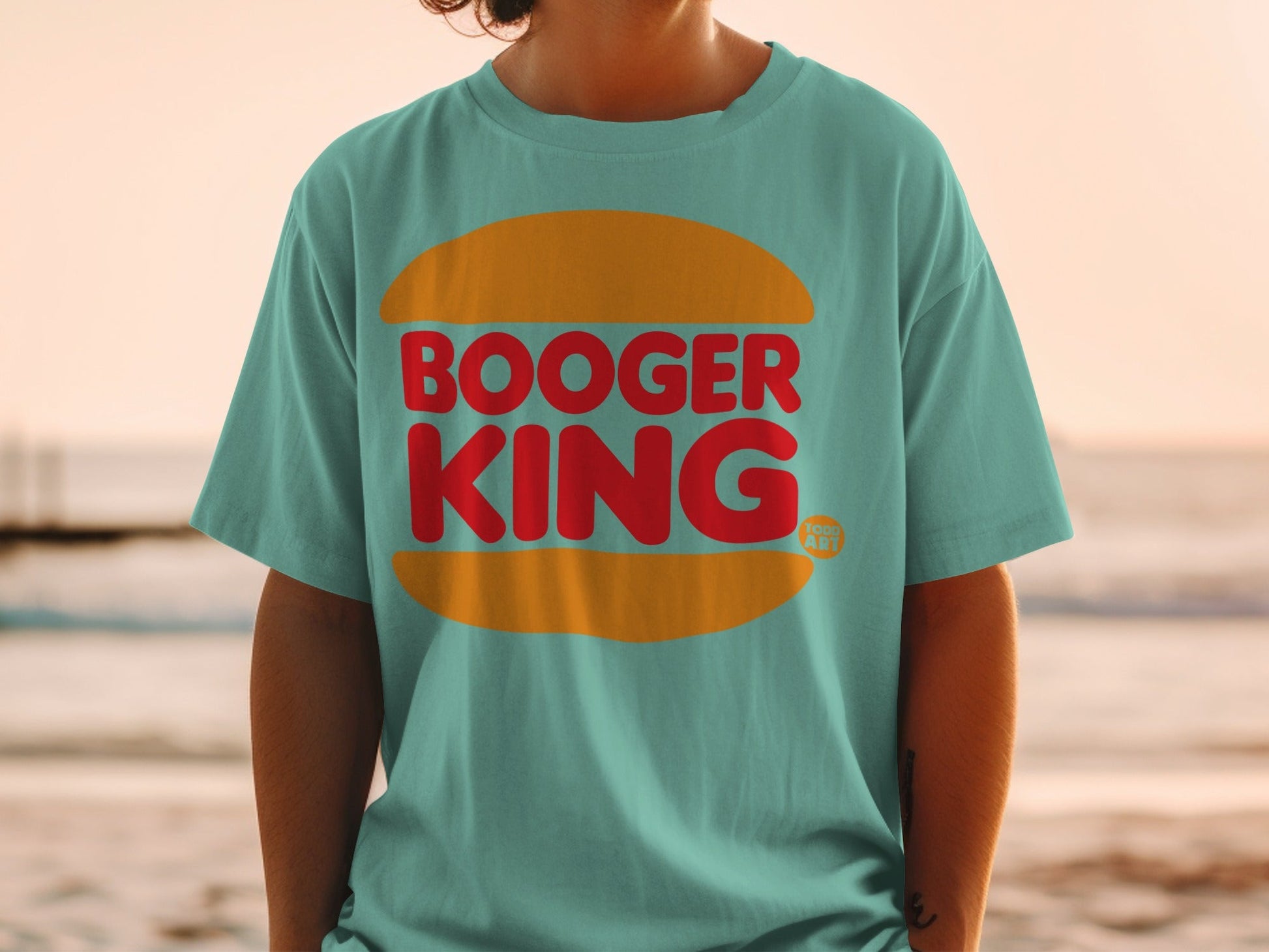 Teal t-shirt with red "BOOGER KING" text in a yellow burger bun shape.
