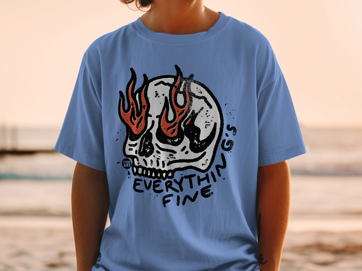 Blue t-shirt with skull and flames graphic, reading "EVERYTHING FINE".