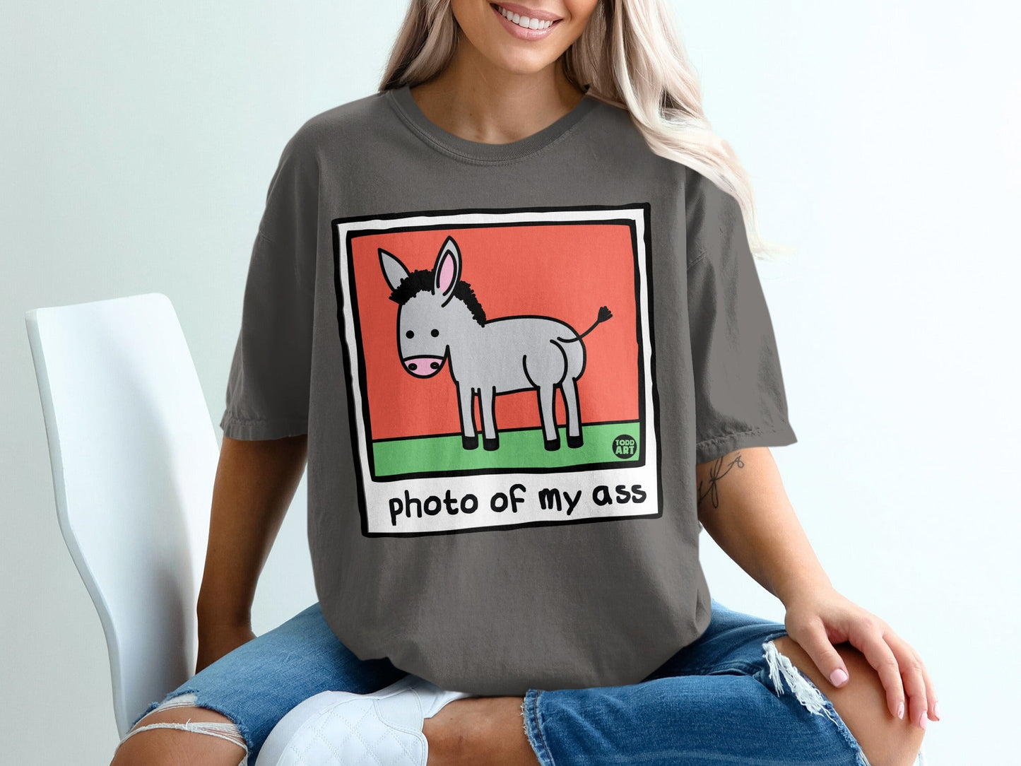 Gray cartoon donkey with "photo of my ass" text on a dark gray t-shirt.