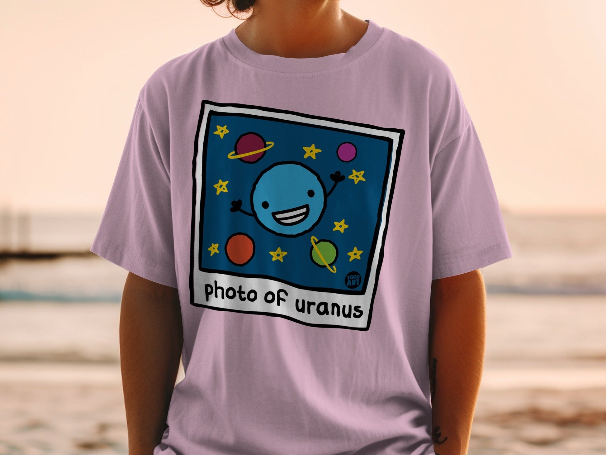 T-shirt with cartoon drawing of Uranus and stars, text reads "Photo of Uranus".