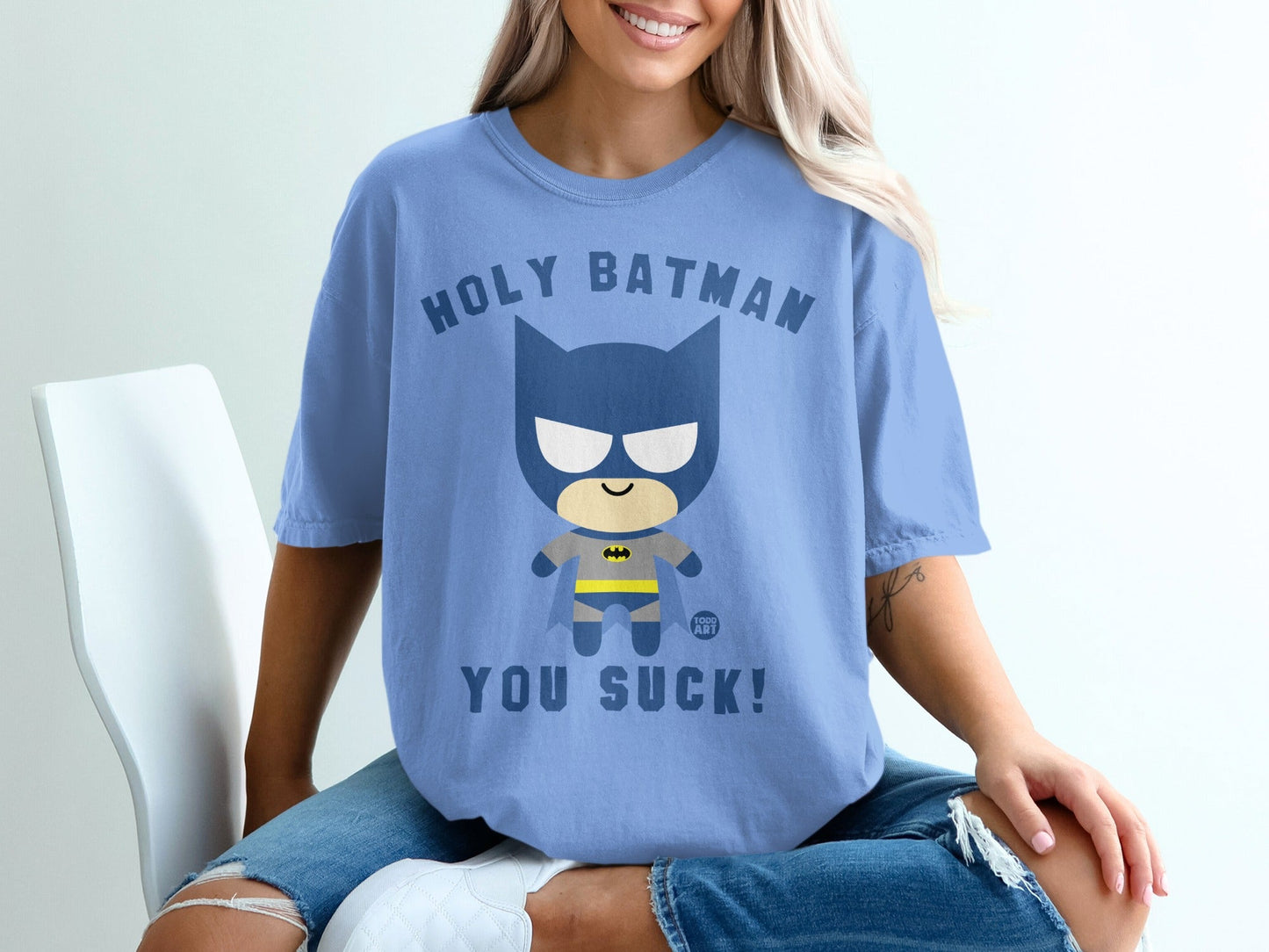 Blue t-shirt with "Holy Batman You Suck!" text and a cartoon Batman graphic.