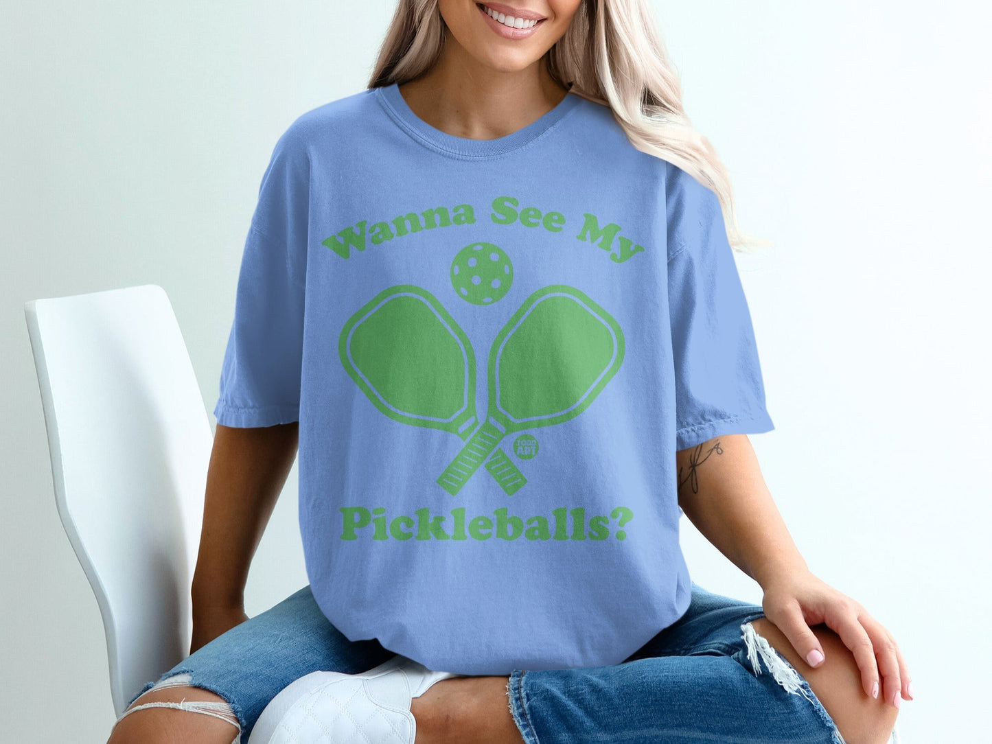 Light blue t-shirt with "Wanna See My Pickleballs?" and pickleball paddles graphic.
