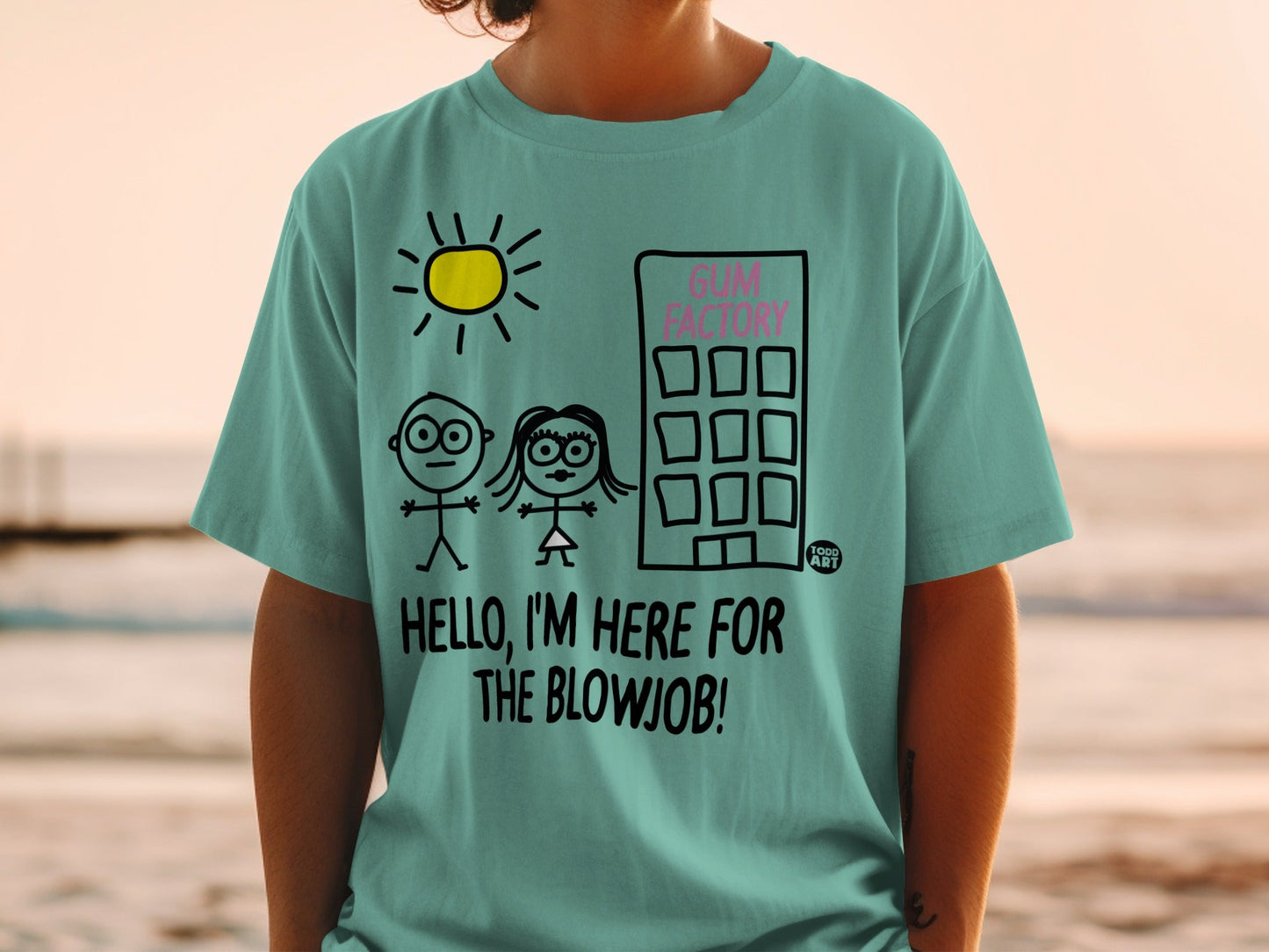 T-shirt with stick figures, sun, building, and text "HELLO, I'M HERE FOR THE BLOWJOB!".