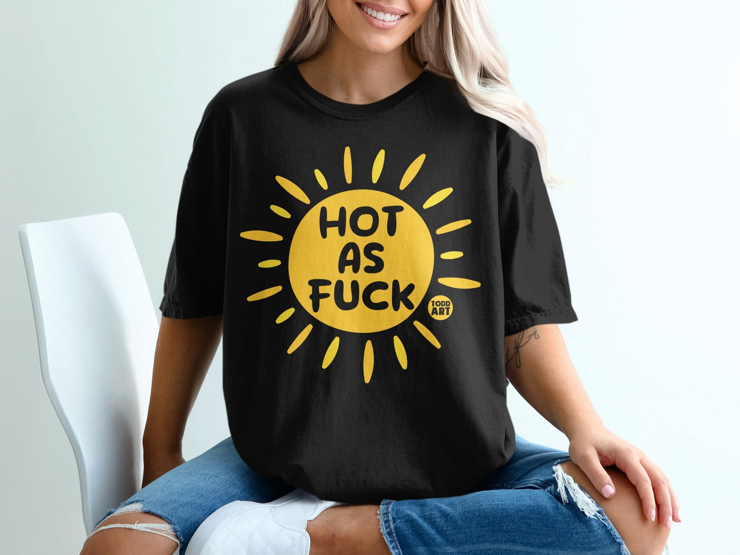 Black t-shirt with yellow sun graphic and text "HOT AS FUCK TODD ART".