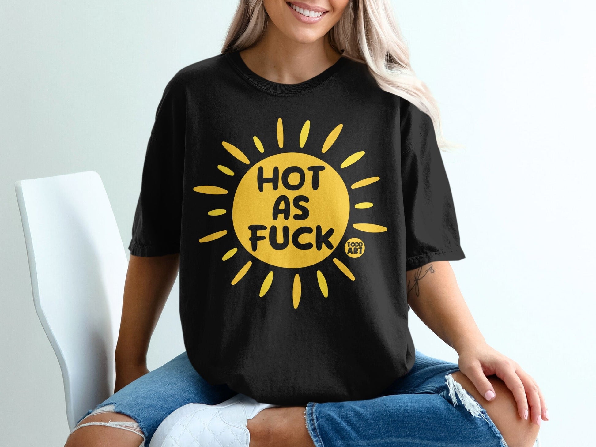 Black t-shirt with yellow sun graphic and text "HOT AS FUCK TODD ART".