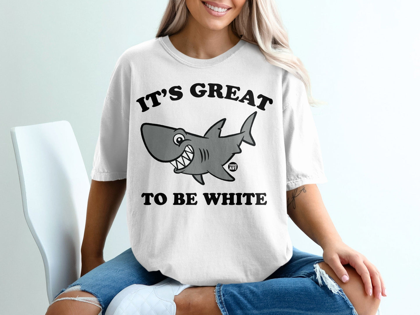 T-shirt with cartoon shark and text "IT'S GREAT TO BE WHITE".
