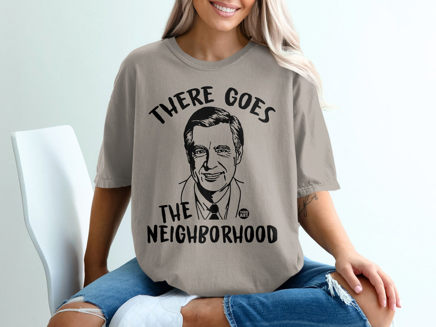 T-shirt with Mr. Rogers graphic and "There Goes The Neighborhood" text.