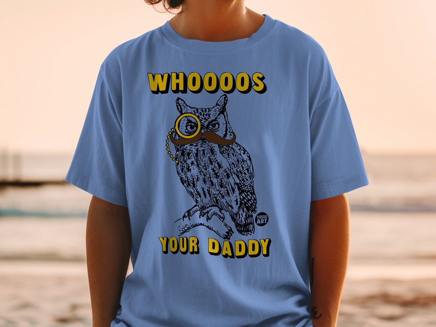 Blue t-shirt with a vintage owl wearing a monocle and mustache, saying WHOOO'S YOUR DADDY.