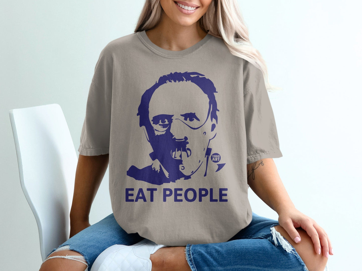 T-shirt with dark blue Hannibal Lecter graphic and "EAT PEOPLE" text.