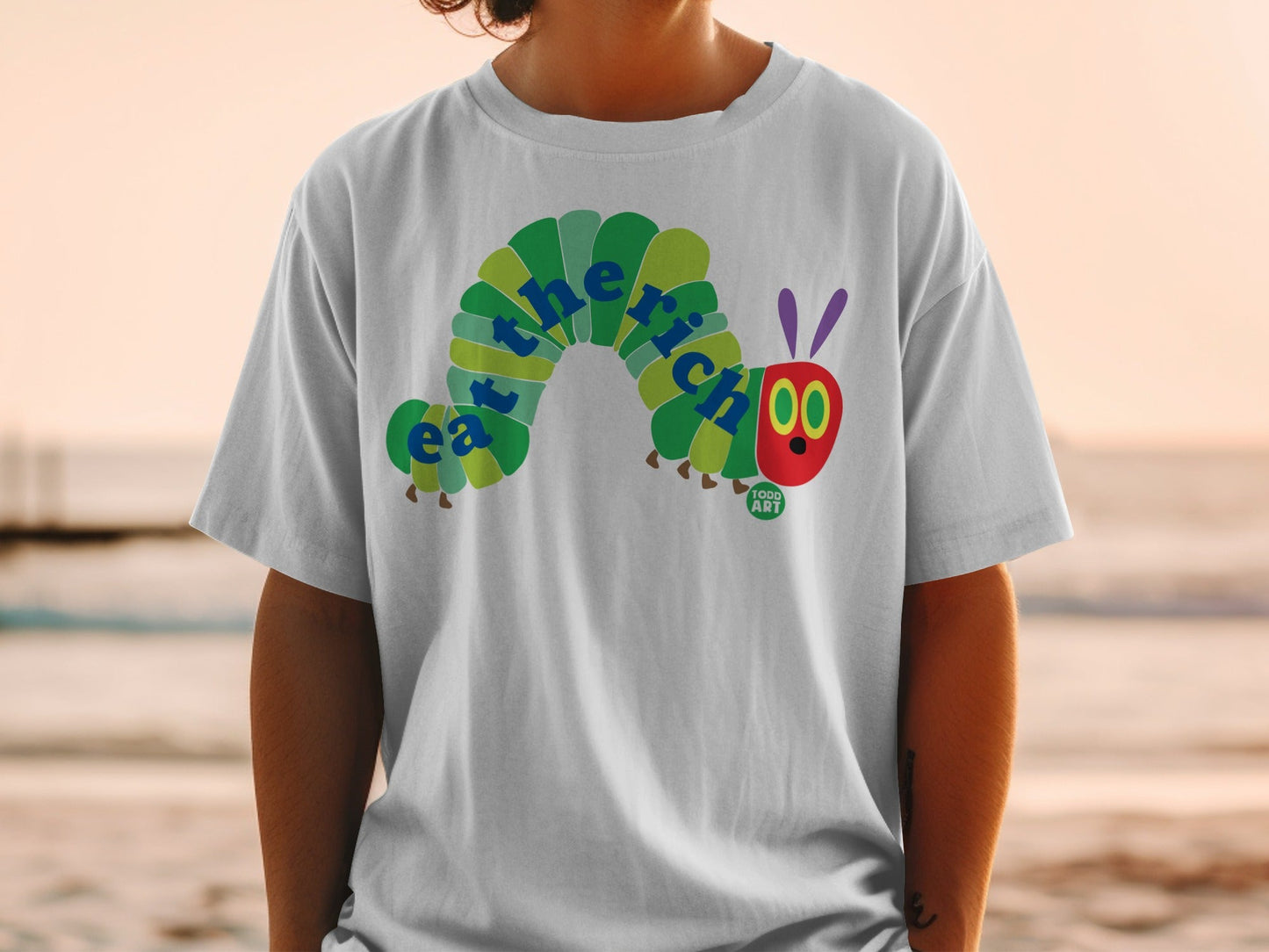 The Very Hungry Caterpillar graphic on a white t-shirt.