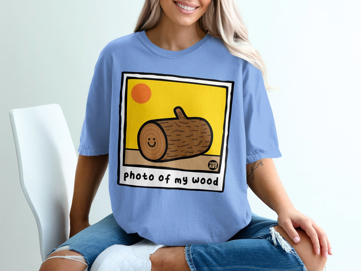 Illustration of a smiling log with "photo of my wood" text.