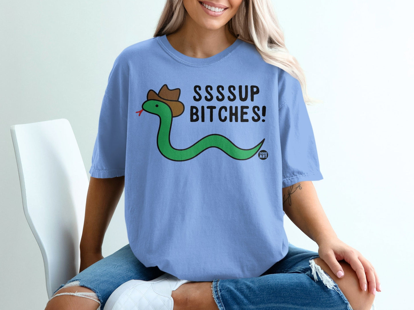 Green snake wearing a cowboy hat and shirt with "SSSUP BITCHES!" text.