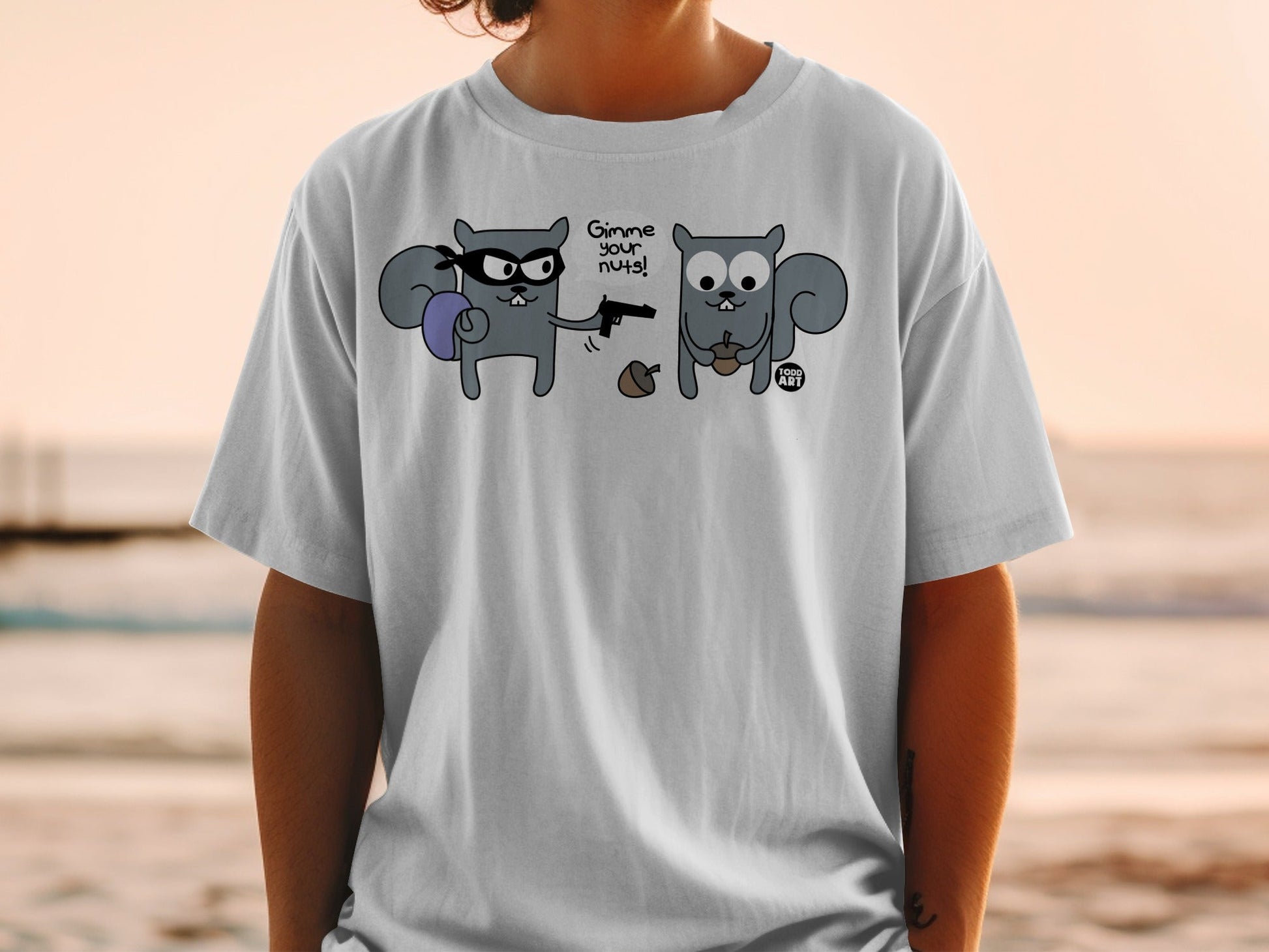 T-shirt with two cartoon squirrels, one robbing the other, with text "Gimme your nuts!".