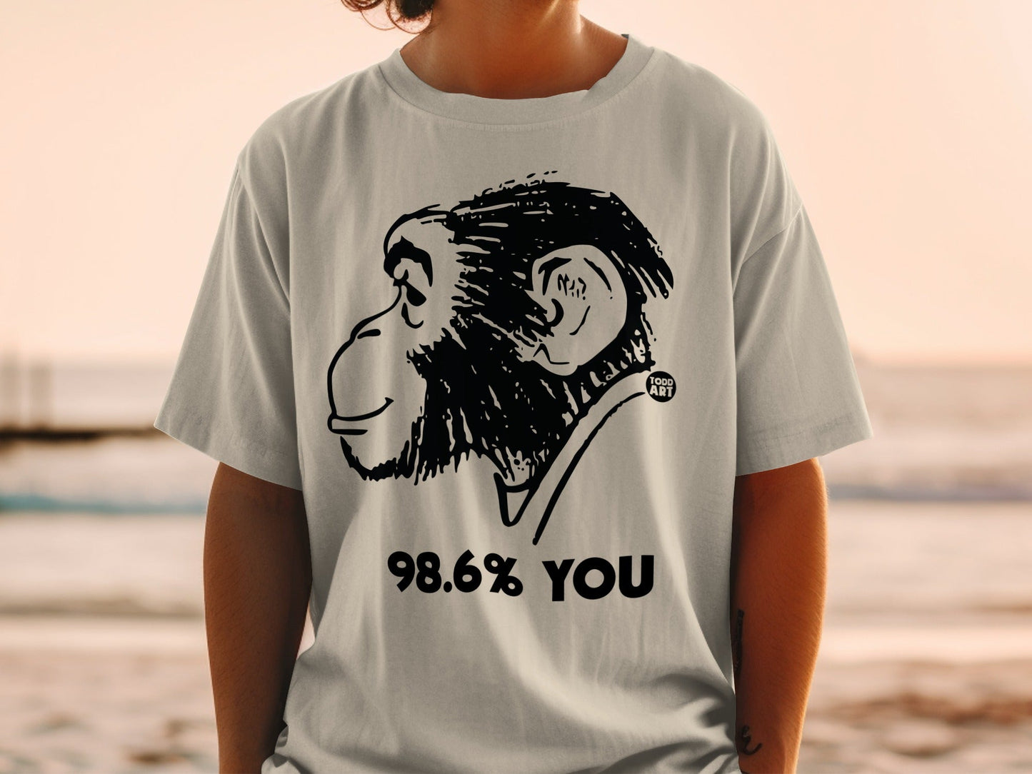 T-shirt with monkey graphic and text "98.6% YOU" and "100% ART".