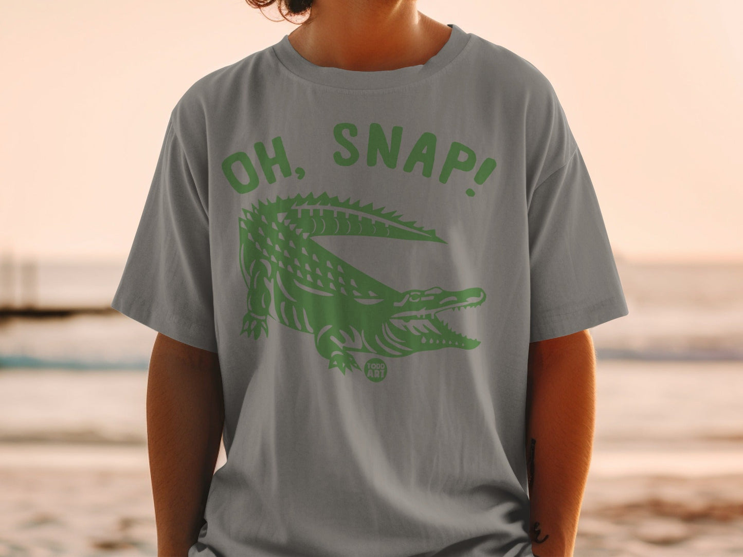 Gray t-shirt with green alligator and "OH, SNAP!" text.