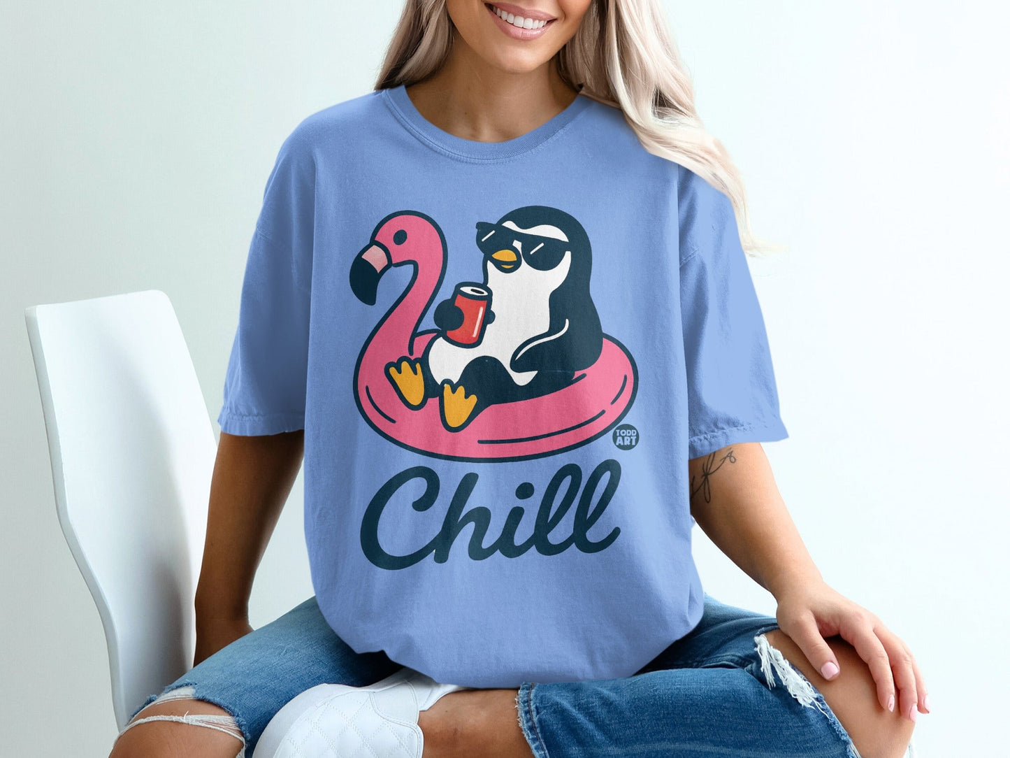 Penguin in flamingo floatie holding drink, "Chill" text.