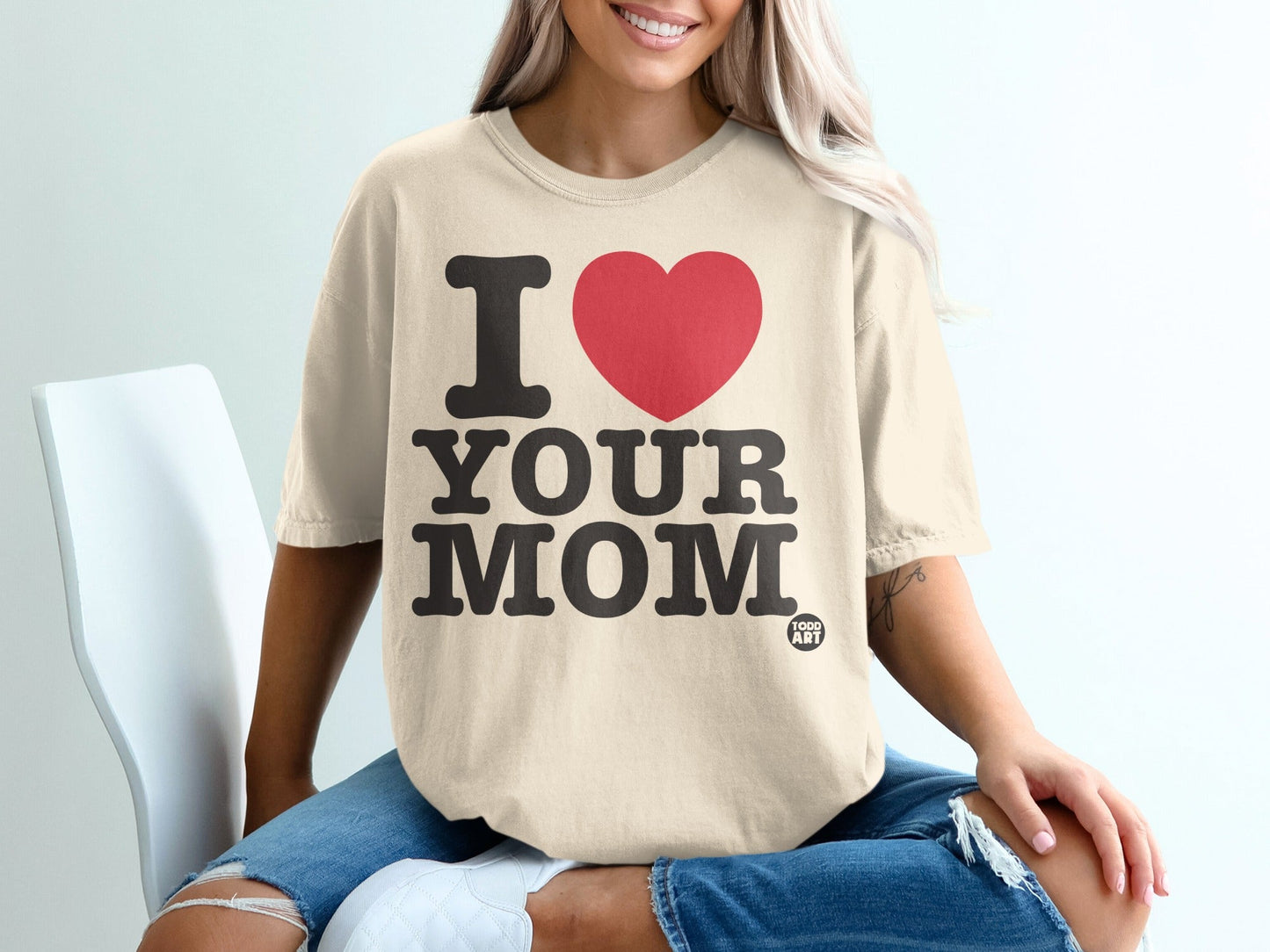 Cream t-shirt with black text "I ‚ù§Ô∏è YOUR MOM" and "TODO ART" logo.