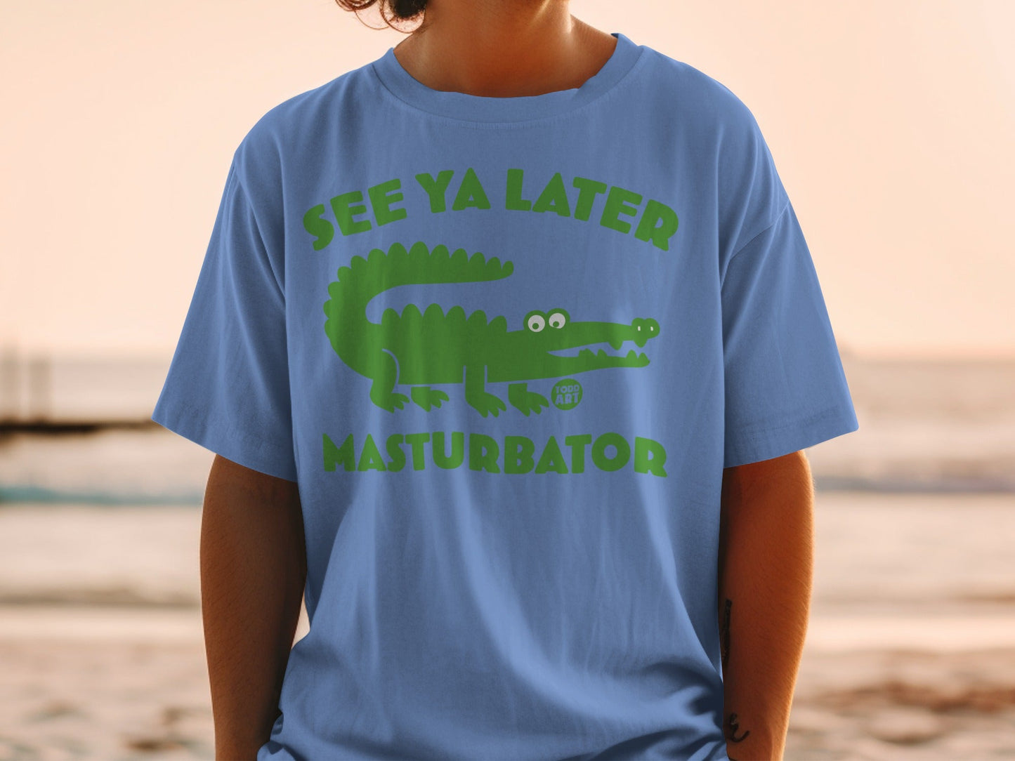 Green alligator graphic with text "SEE YA LATER" and "MASTURBATOR".