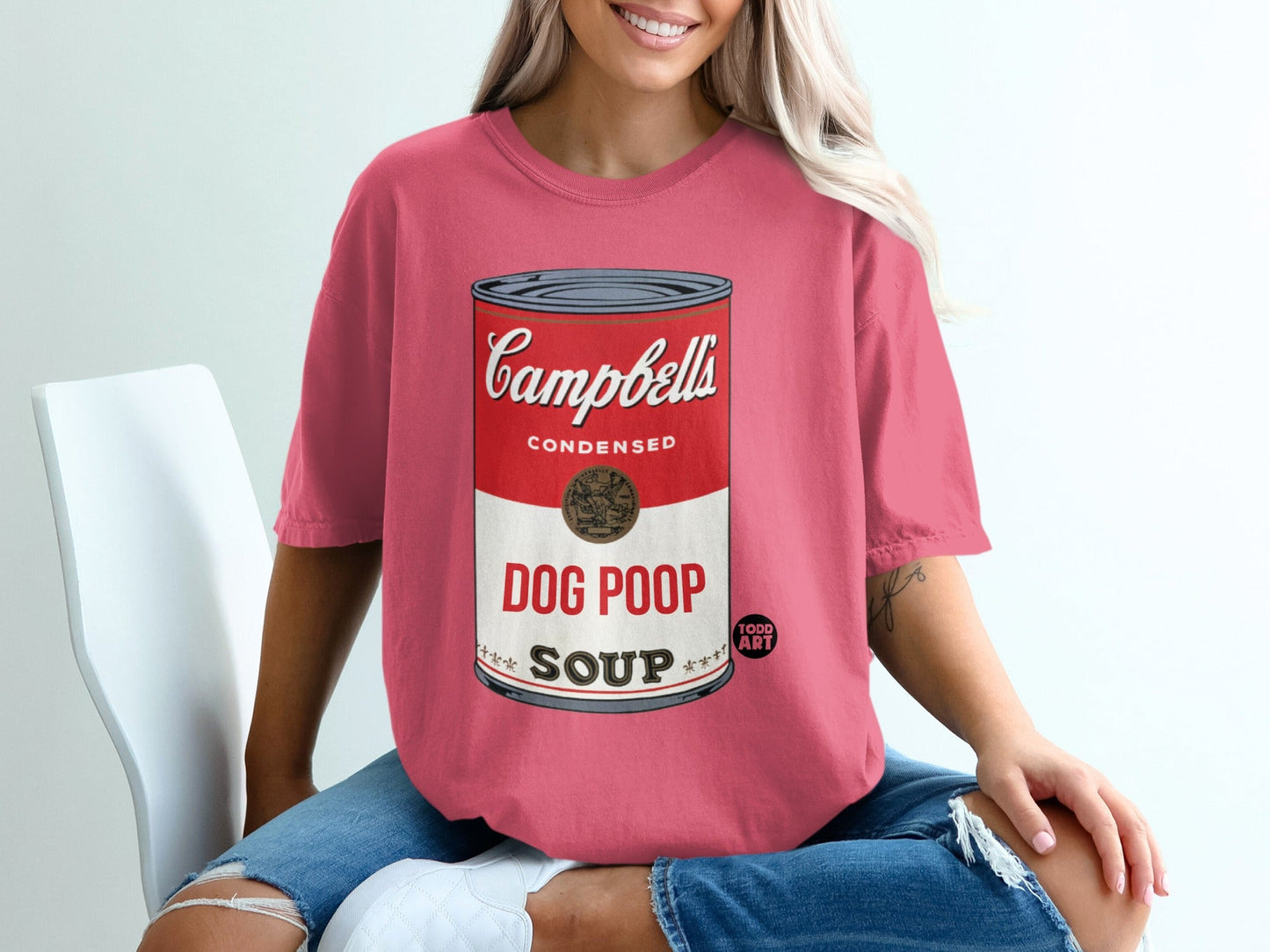 Salmon colored t-shirt with Campbell's Dog Poop Soup logo.