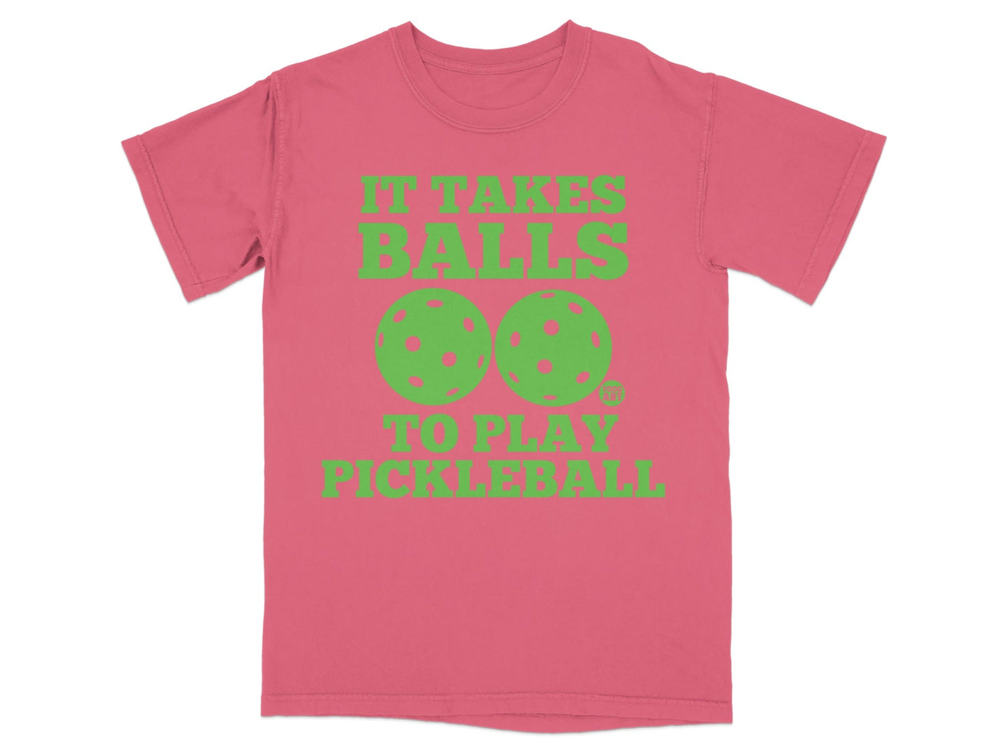 Pink t-shirt with neon green text and pickleballs: "It Takes Balls to Play Pickleball."