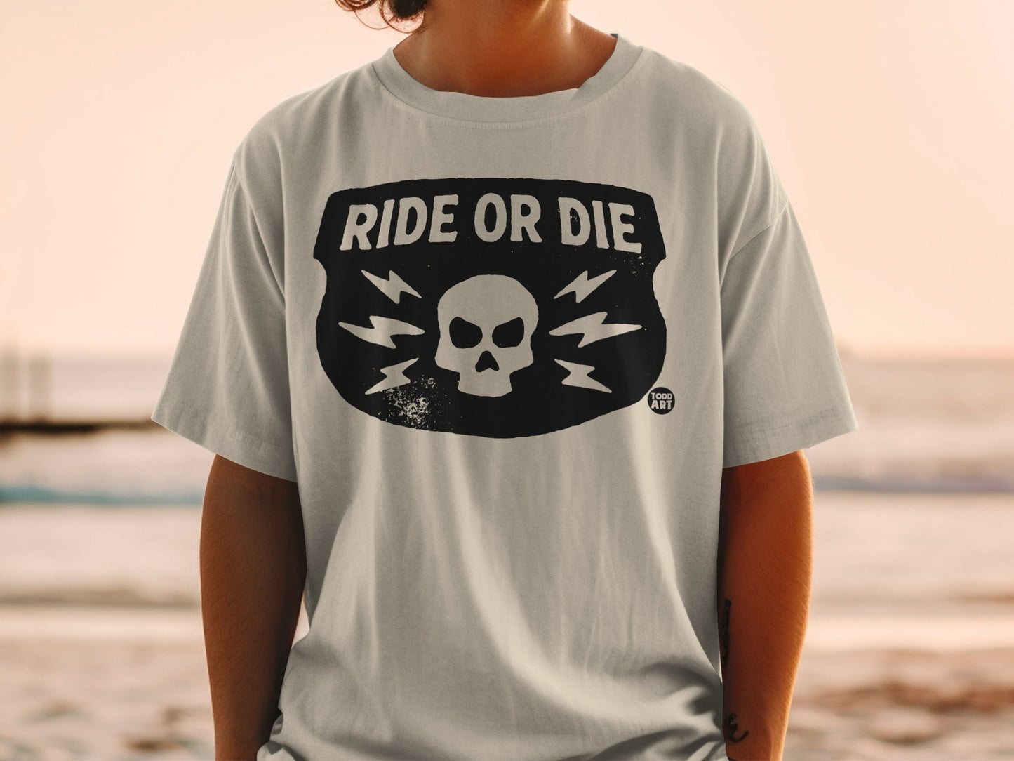 T-shirt with "RIDE OR DIE" and skull with lightning bolts.