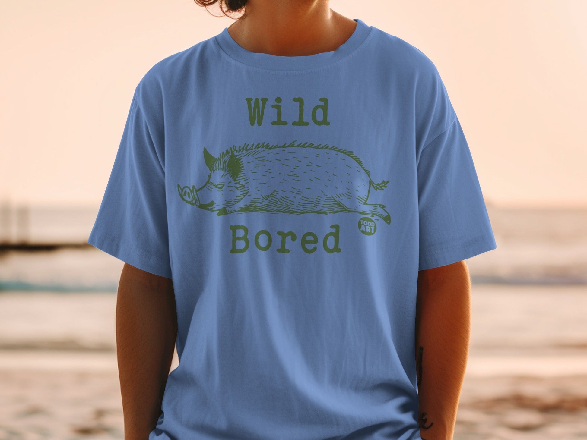 Blue t-shirt with "Wild Bored" text and a drawn boar.