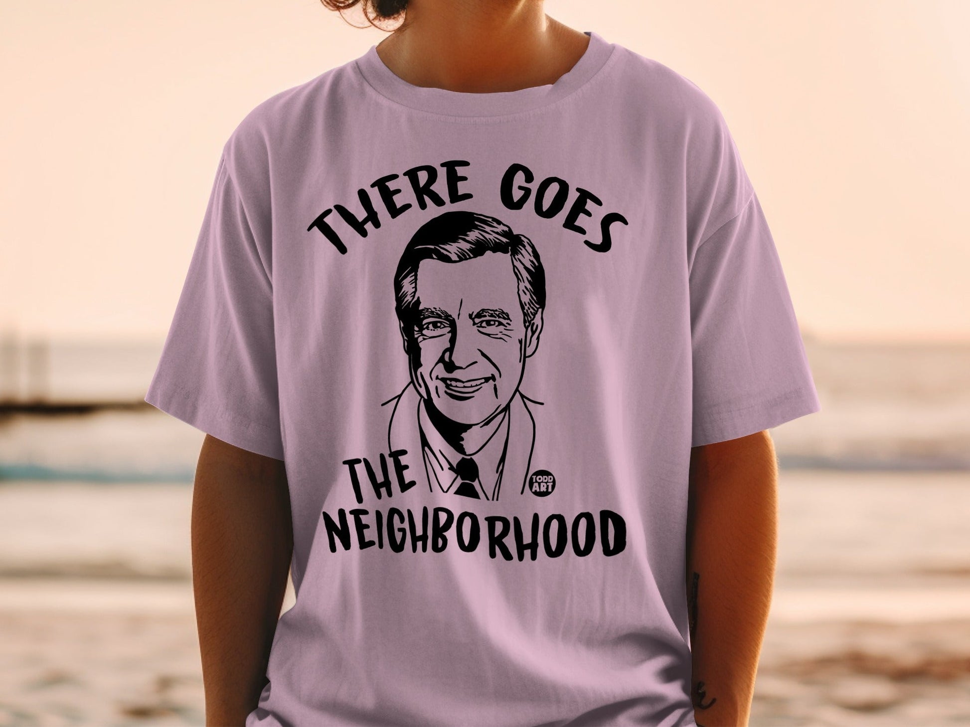T-shirt with black illustration of Fred Rogers and text "There Goes the Neighborhood".