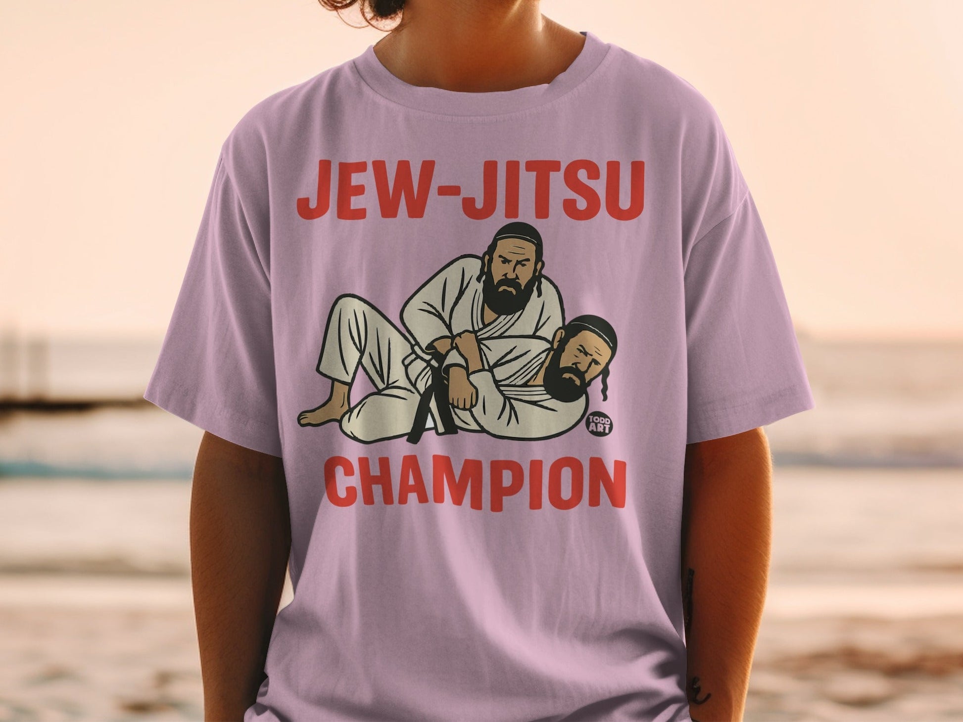 T-shirt with "Jew-Jitsu Champion" text and illustration of two men grappling.