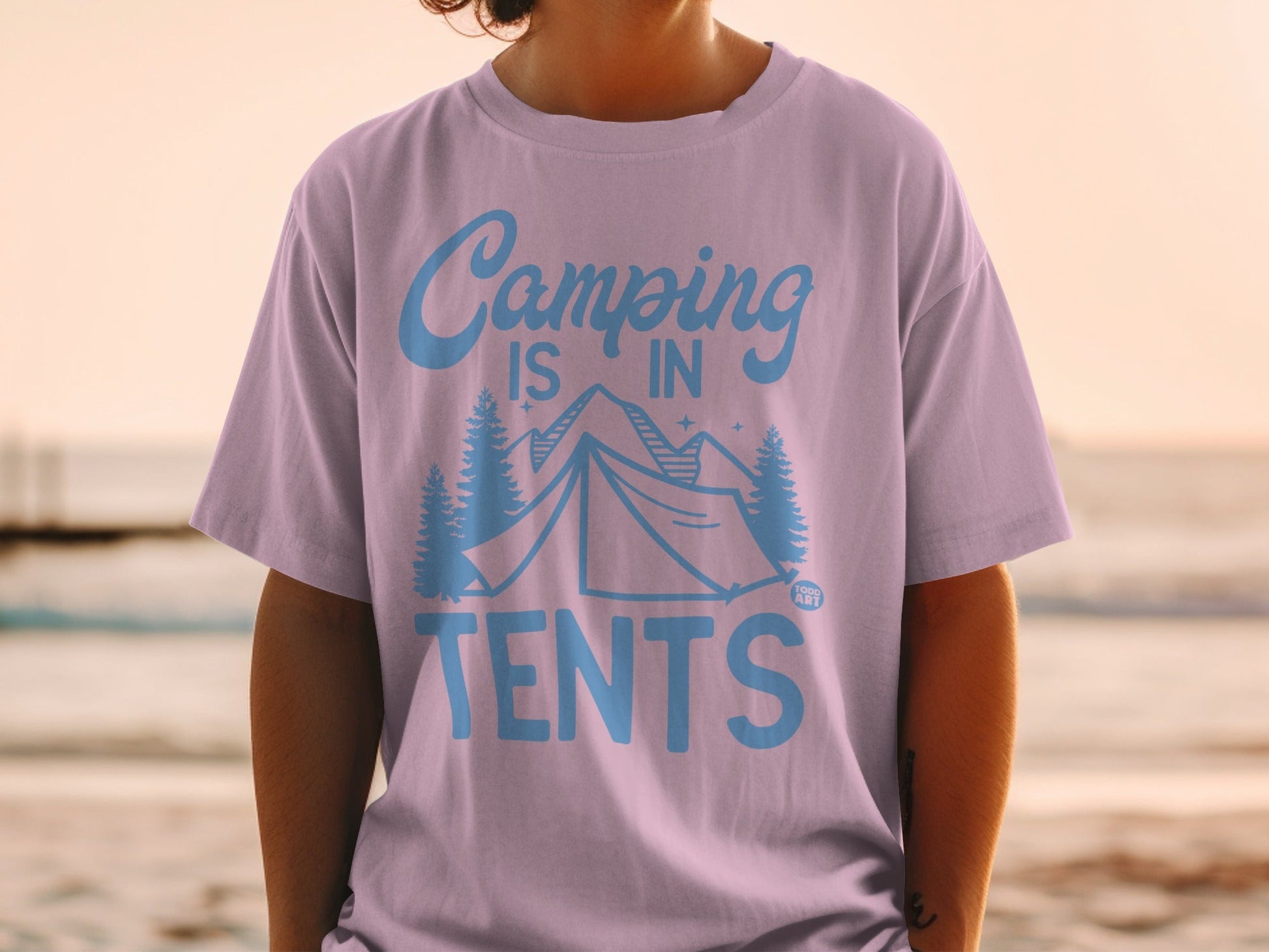 Purple t-shirt with "Camping is in Tents" graphic featuring a tent and trees.