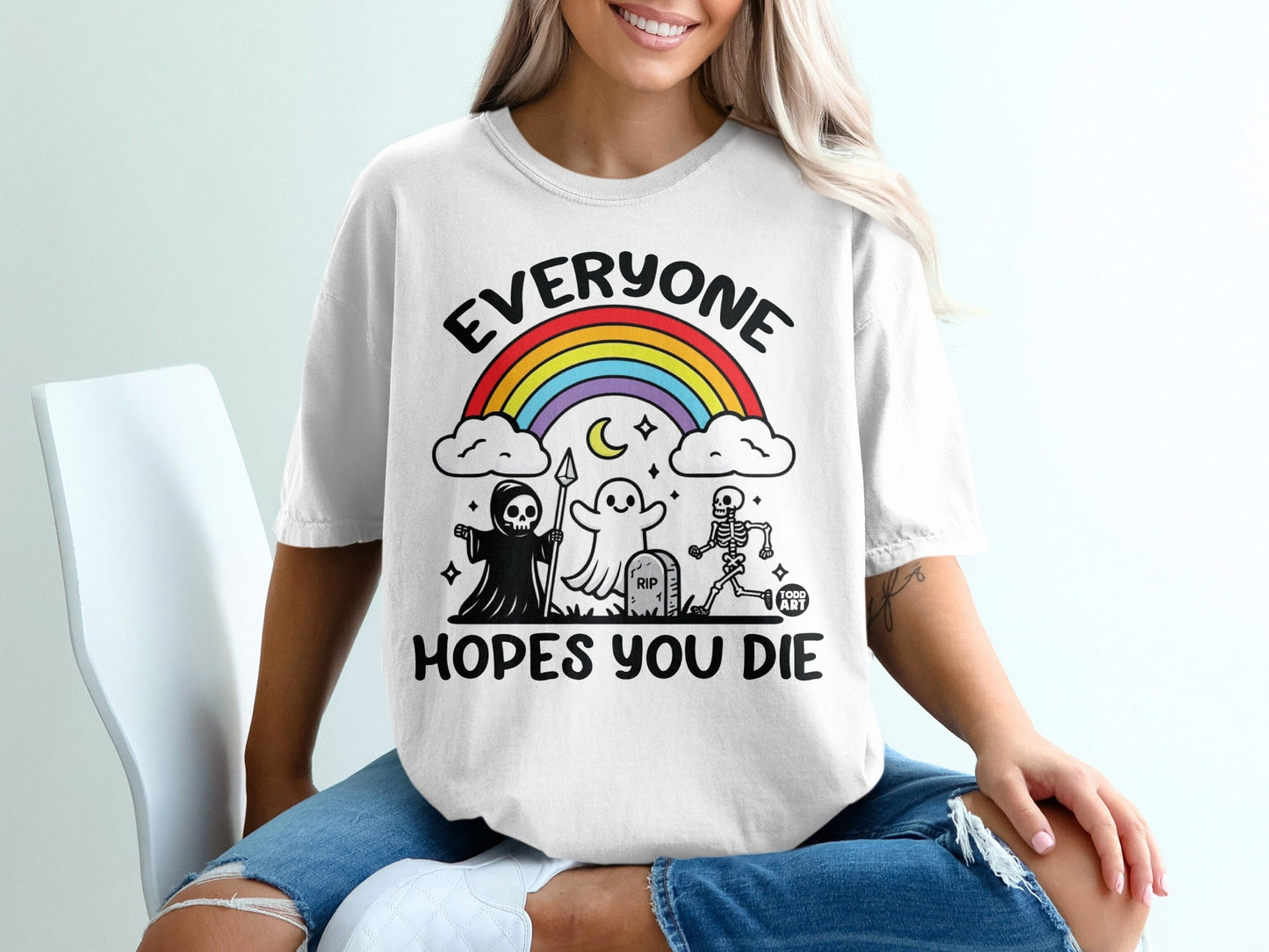 White t-shirt with rainbow, ghost, skeleton, and grim reaper graphic.