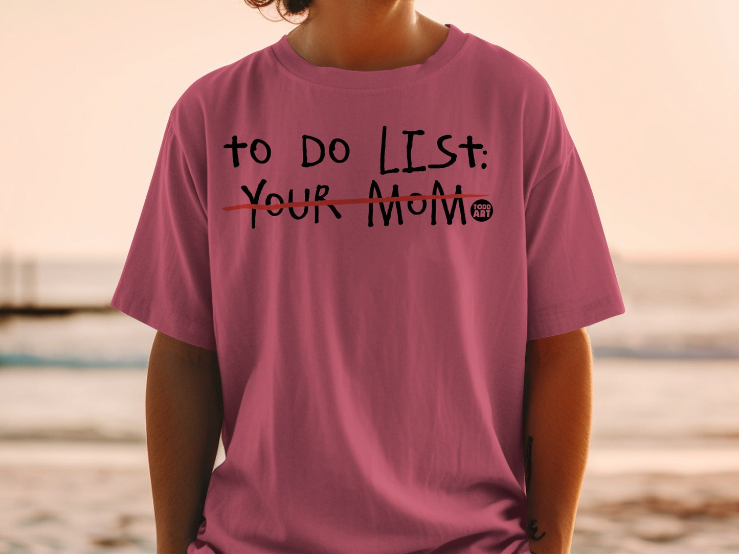 Pink t-shirt with "TO DO LIST: YOUR MOM" text, crossed out.