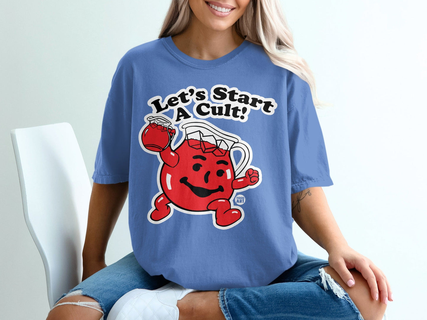 Blue t-shirt with Kool-Aid Man illustration and text "Let's Start A Cult!".