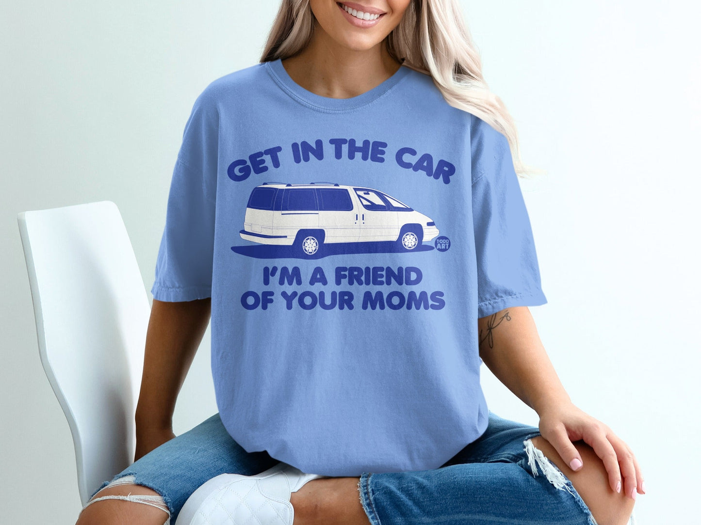Blue t-shirt with white text and van graphic that reads "Get in the car I'm a friend of your moms".