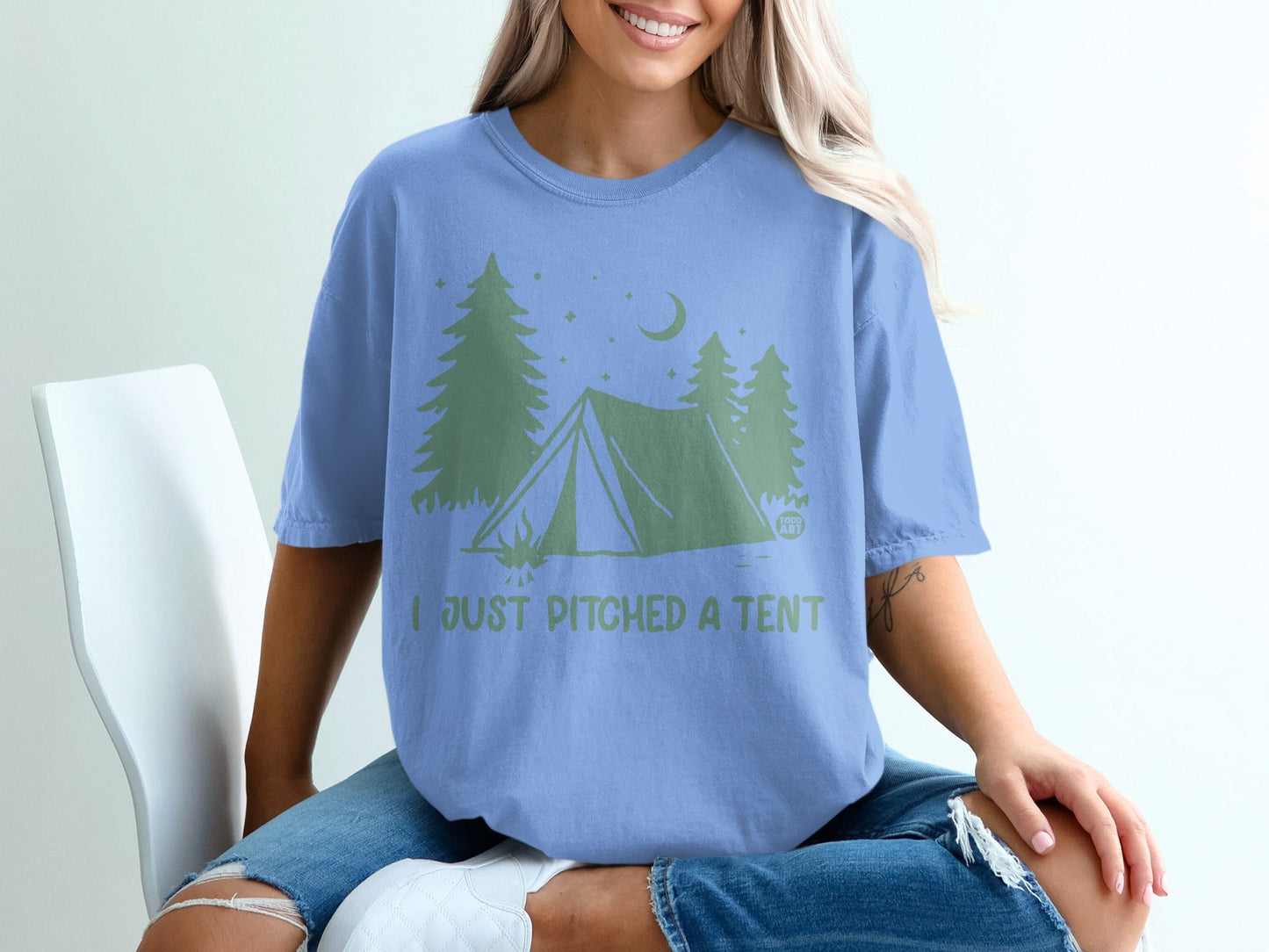 Blue t-shirt with green tent graphic and "I JUST PITCHED A TENT" text.