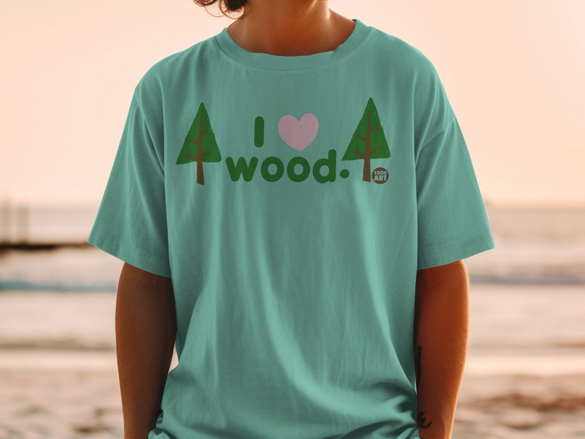Teal t-shirt with "I love wood" text and tree graphics.