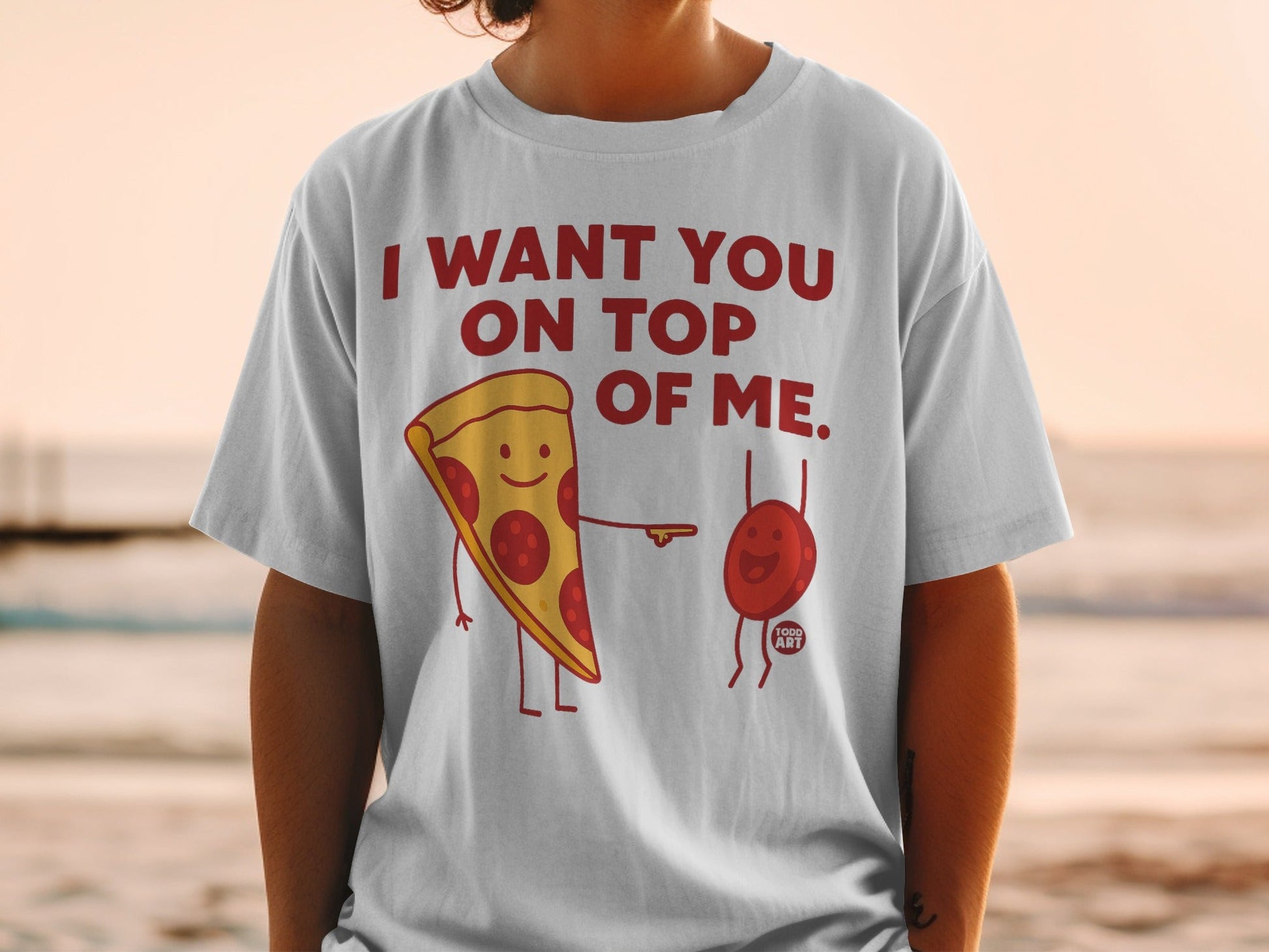 T-shirt with pepperoni pizza slice and red blood cell graphic saying "I want you on top of me."