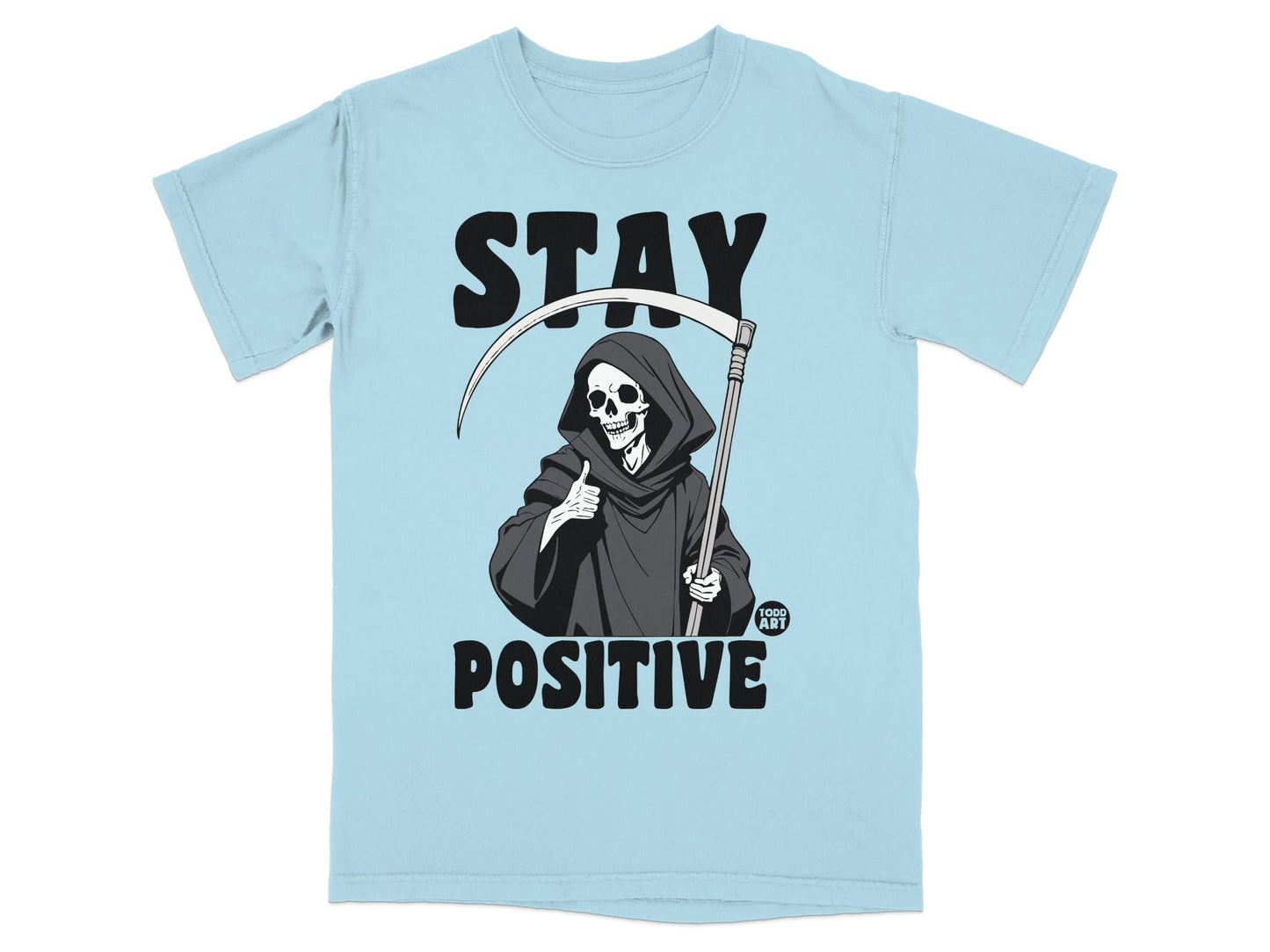 Light blue t-shirt with Grim Reaper giving a thumbs up and "STAY POSITIVE" text.