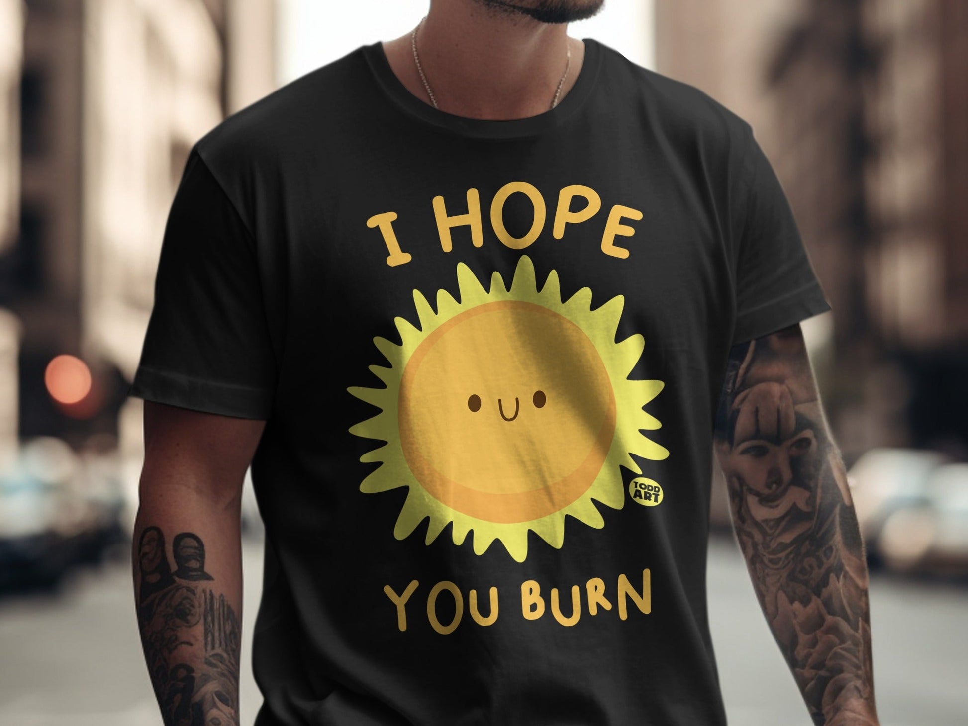 Black t-shirt with yellow sun graphic and text "I HOPE YOU BURN".
