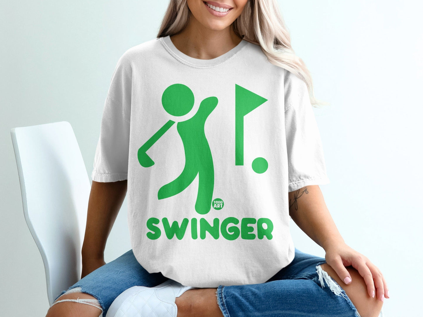 Green graphic of a golfer swinging a club, with a golf flag, and the word "SWINGER".