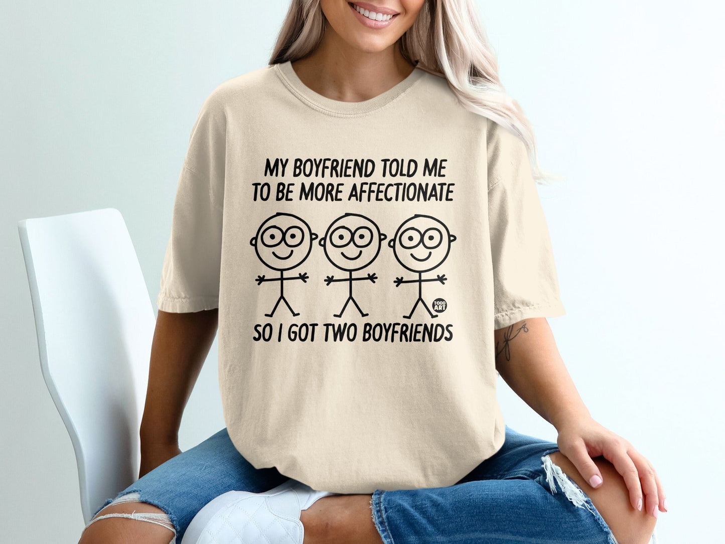 T-shirt with cartoon stick figures and text: "My boyfriend told me to be more affectionate so I got two boyfriends."