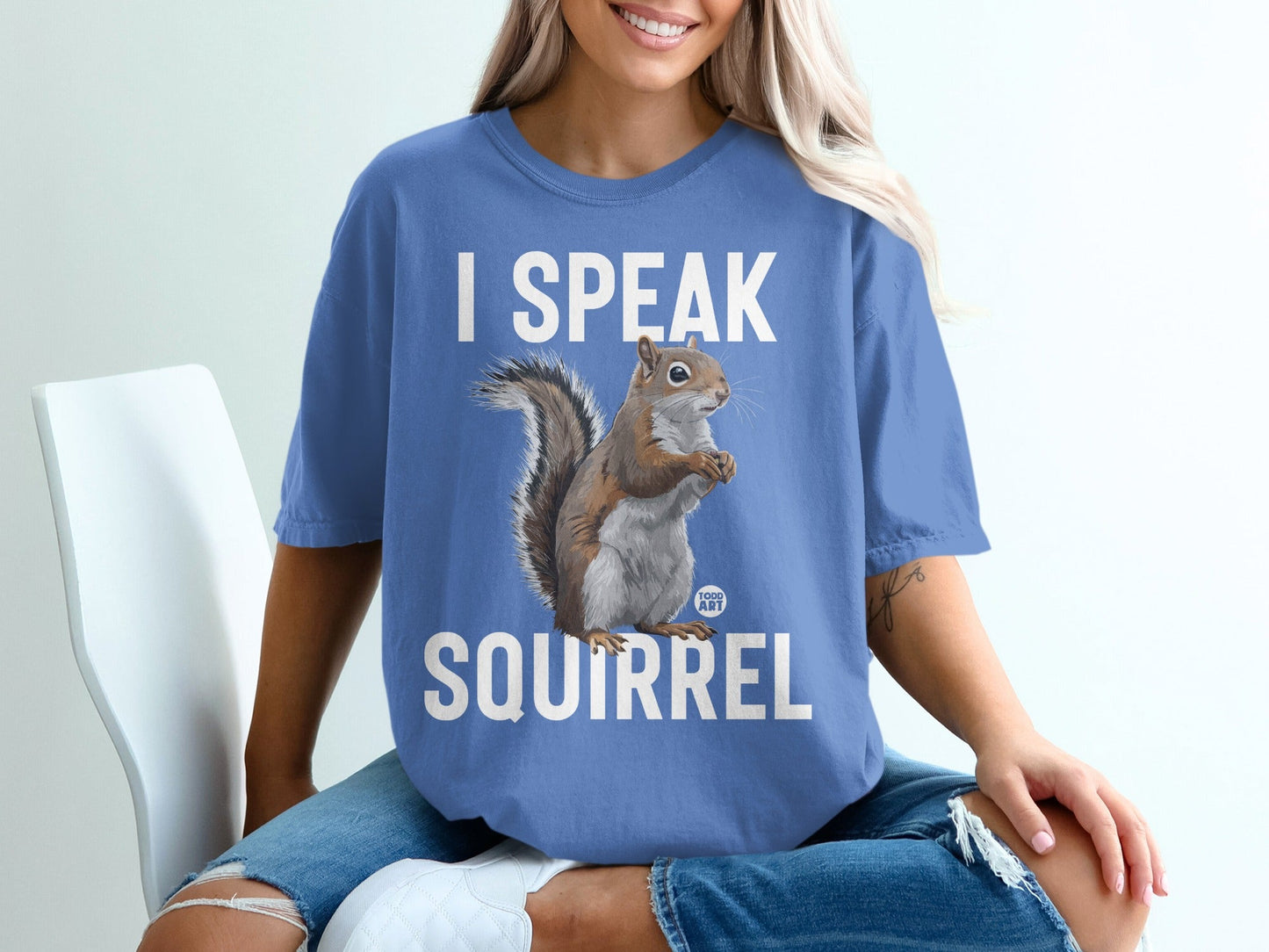 Blue t-shirt with "I SPEAK SQUIRREL" text and a squirrel graphic.