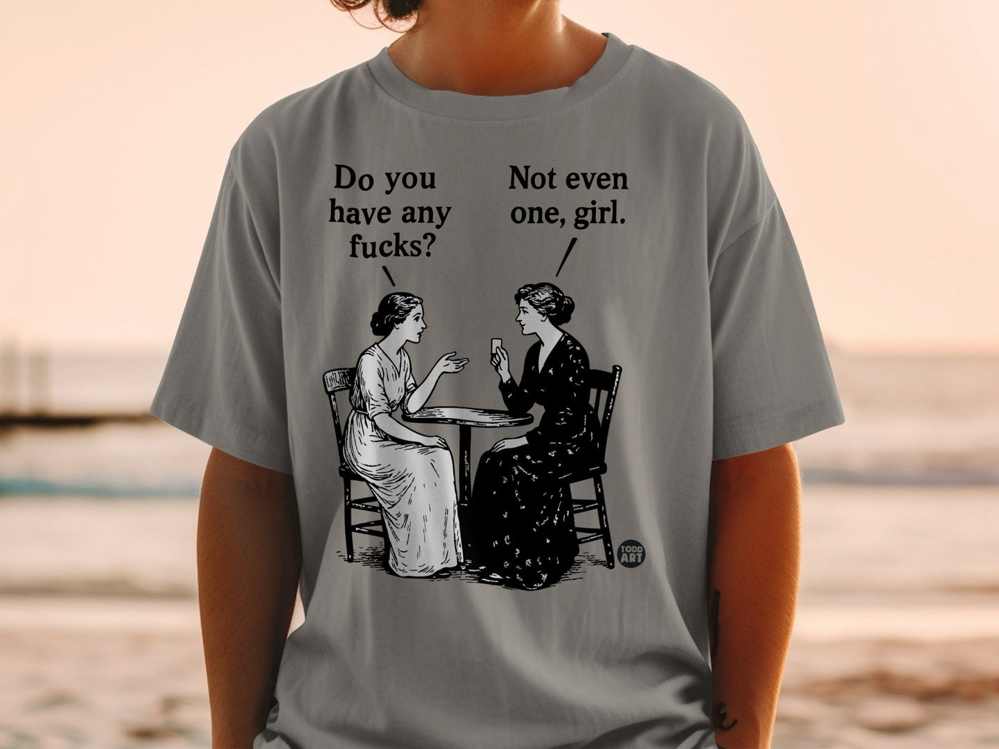 Illustration of two women at a table with text "Do you have any fucks?" and "Not even one, girl."