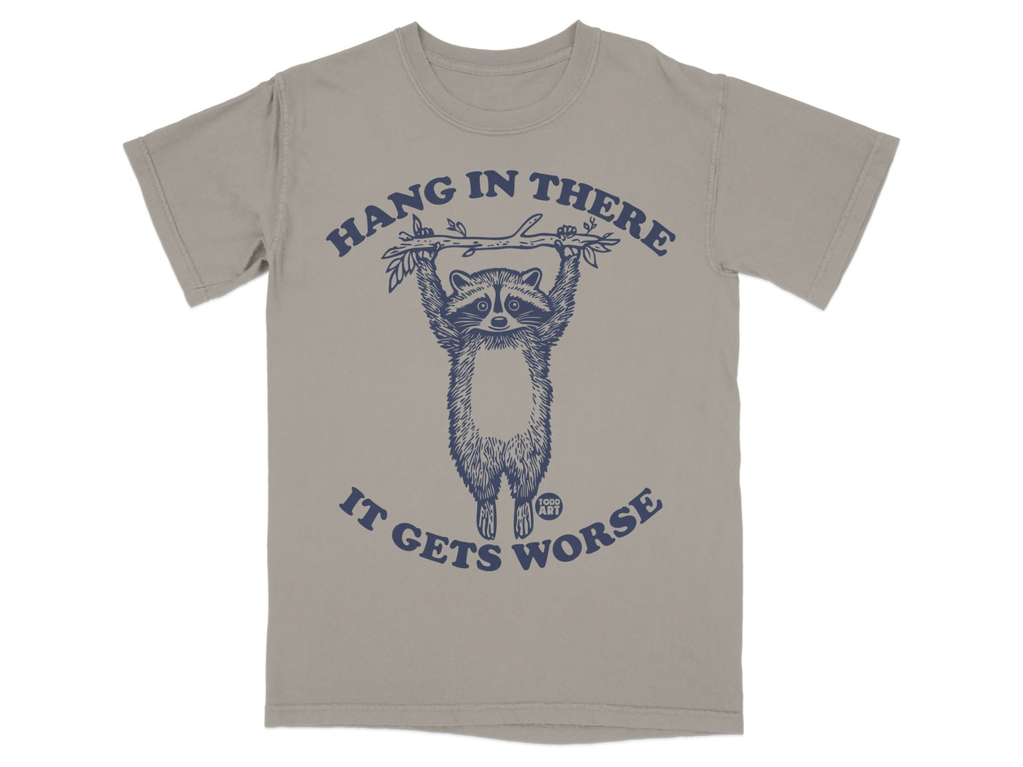T-shirt with a raccoon hanging from a branch, text reads "Hang in there, it gets worse."
